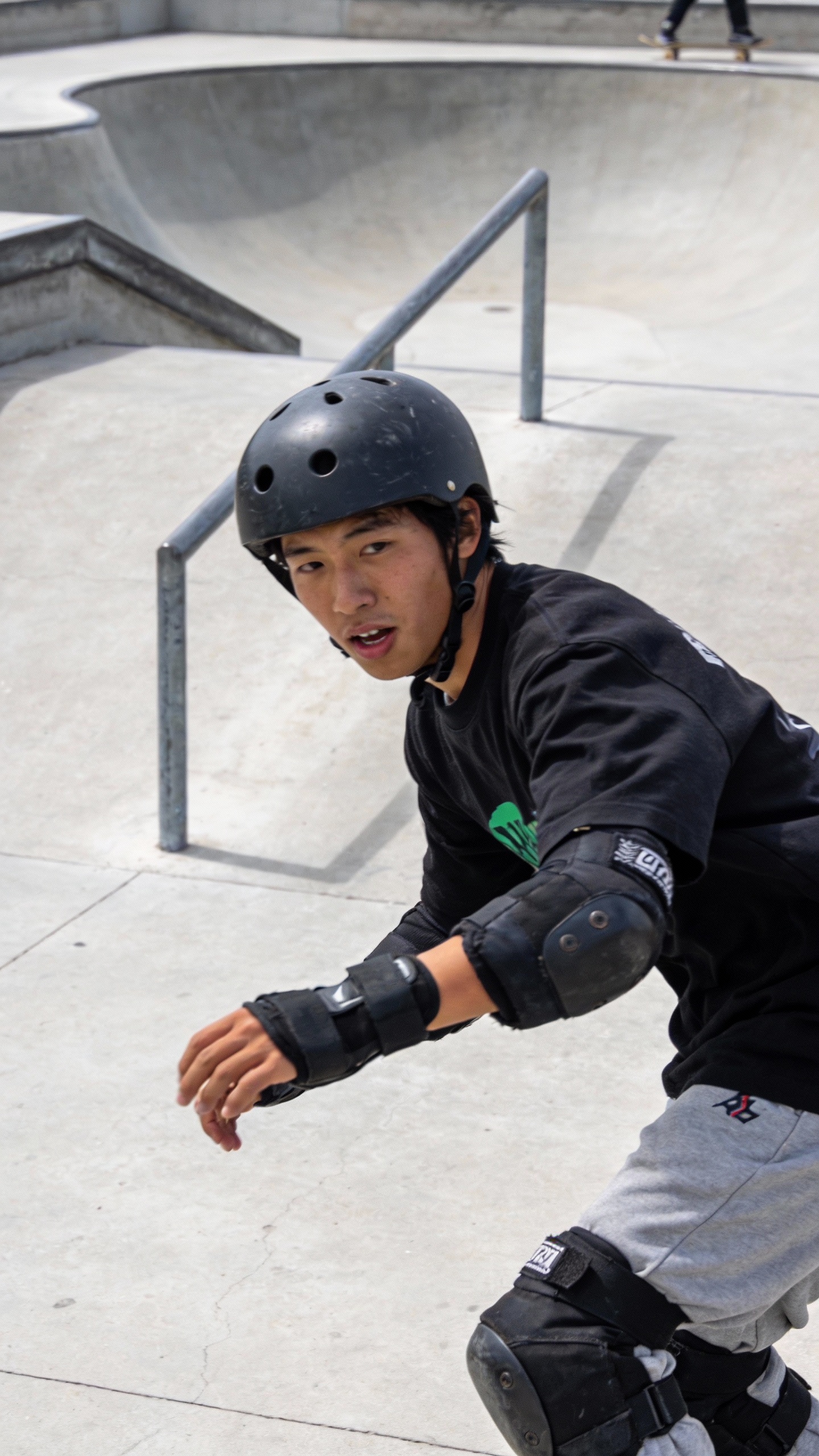 Skateboarder At Outdoor Skatepark