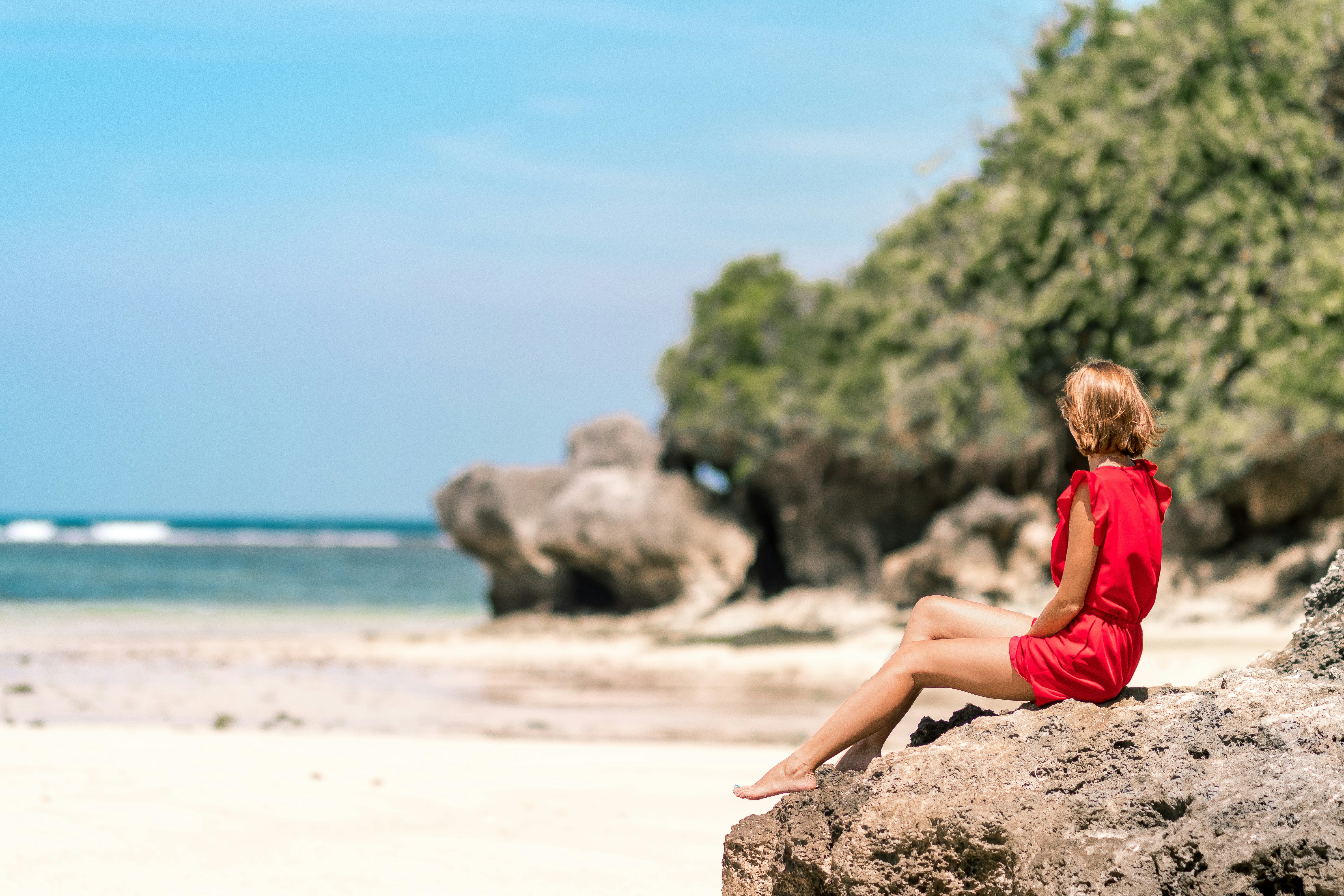Woman in Red on Tropical Beach