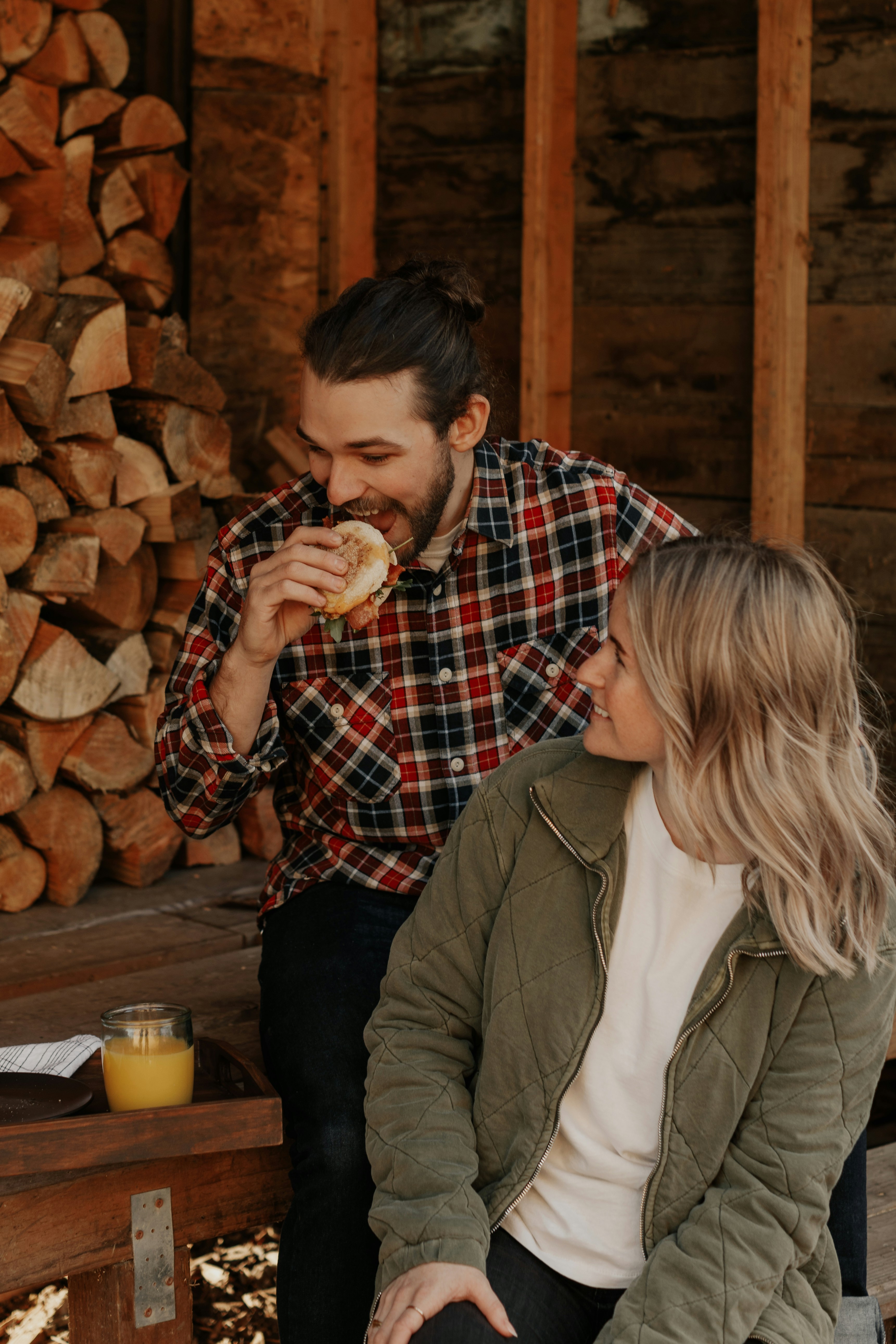 Couple Enjoying Outdoor Meal At Cabin
