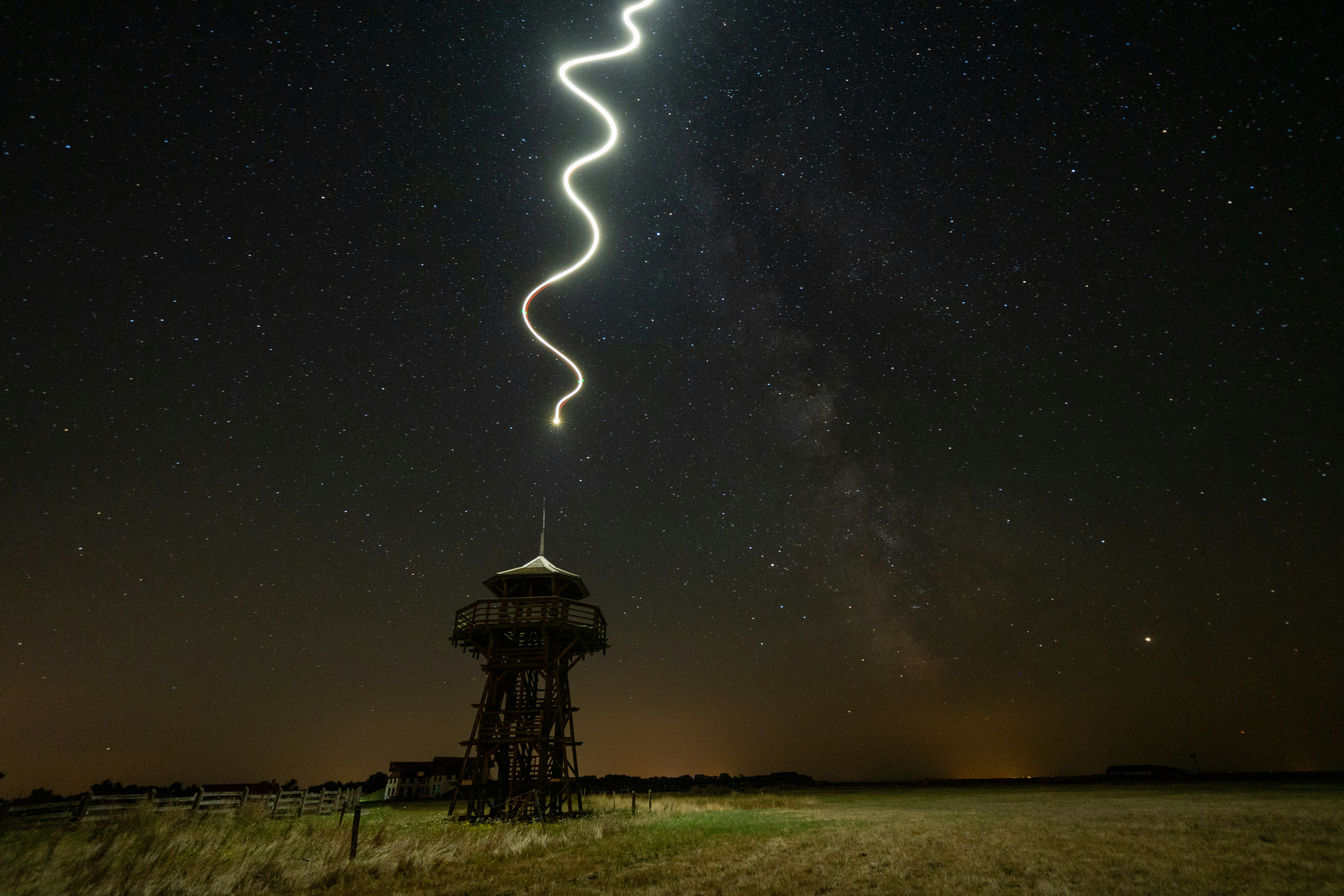 Starry Night Light Trail Over Watchtower