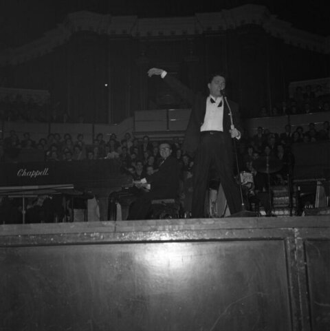 Male Singer Performing on Concert Stage