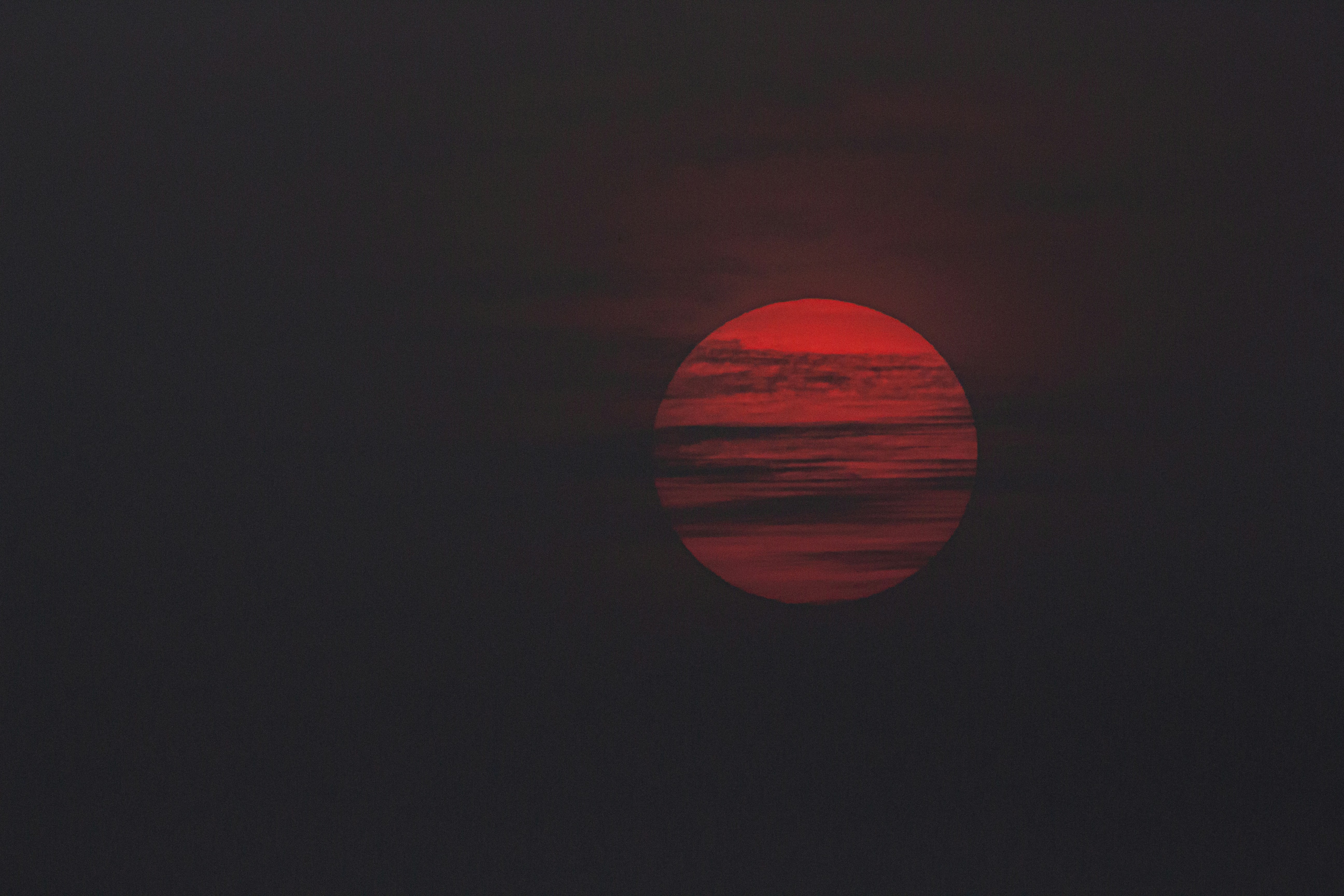 Red Sun Over Dark Water