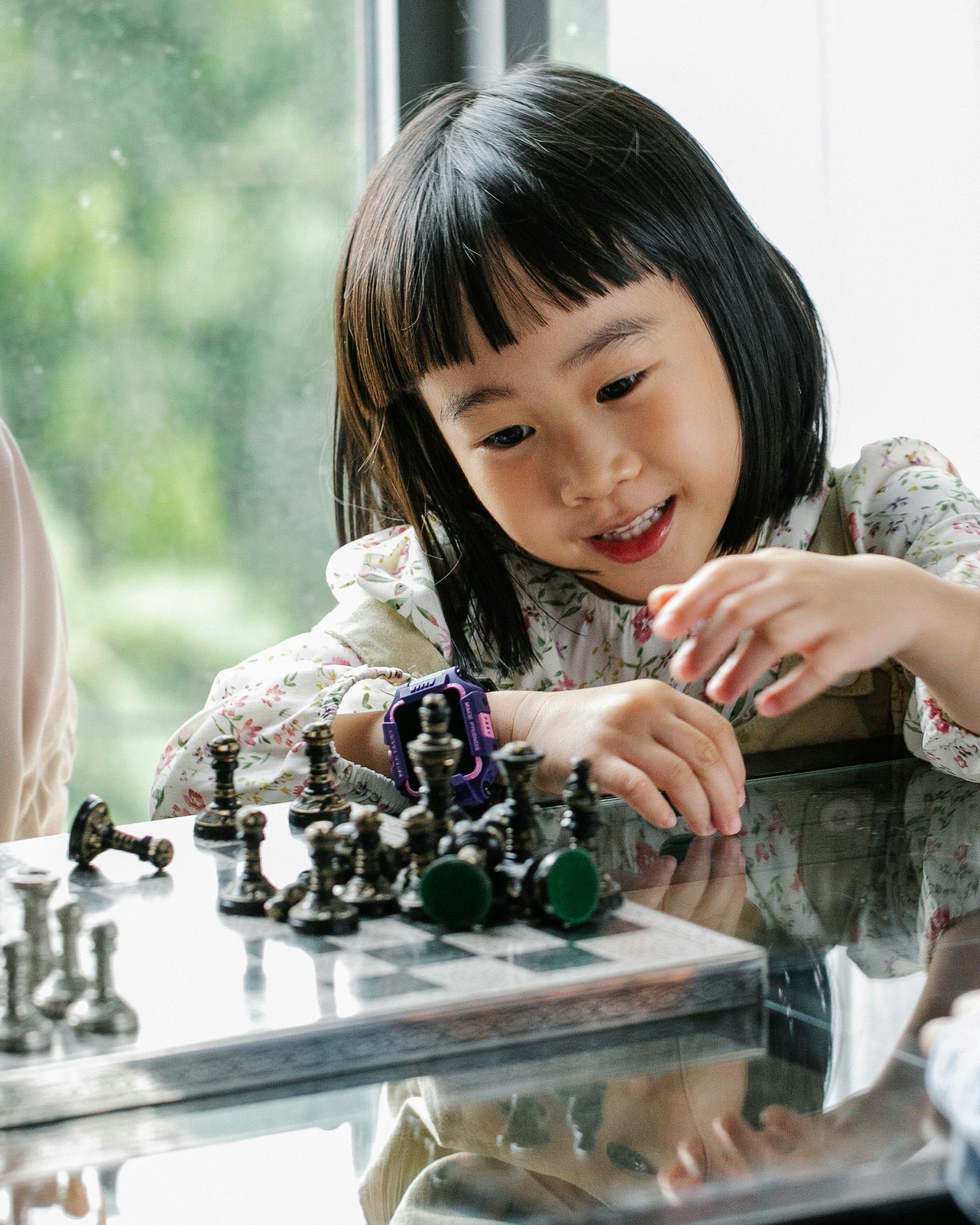 Little Girl Playing Chess