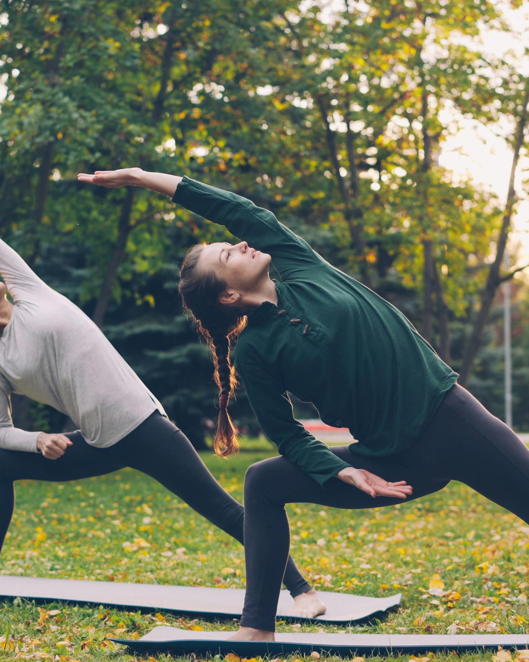 Two People Practicing Outdoor Yoga