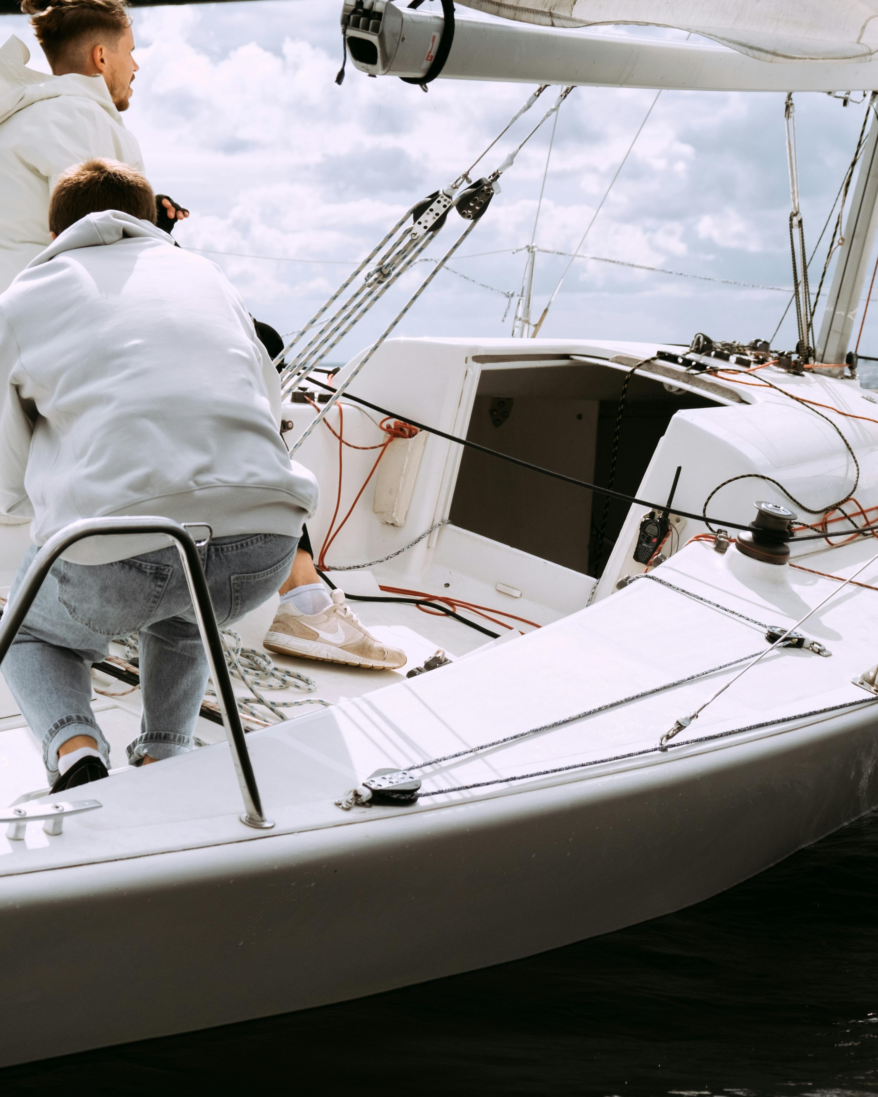 Two Men Sailing on a Sailboat