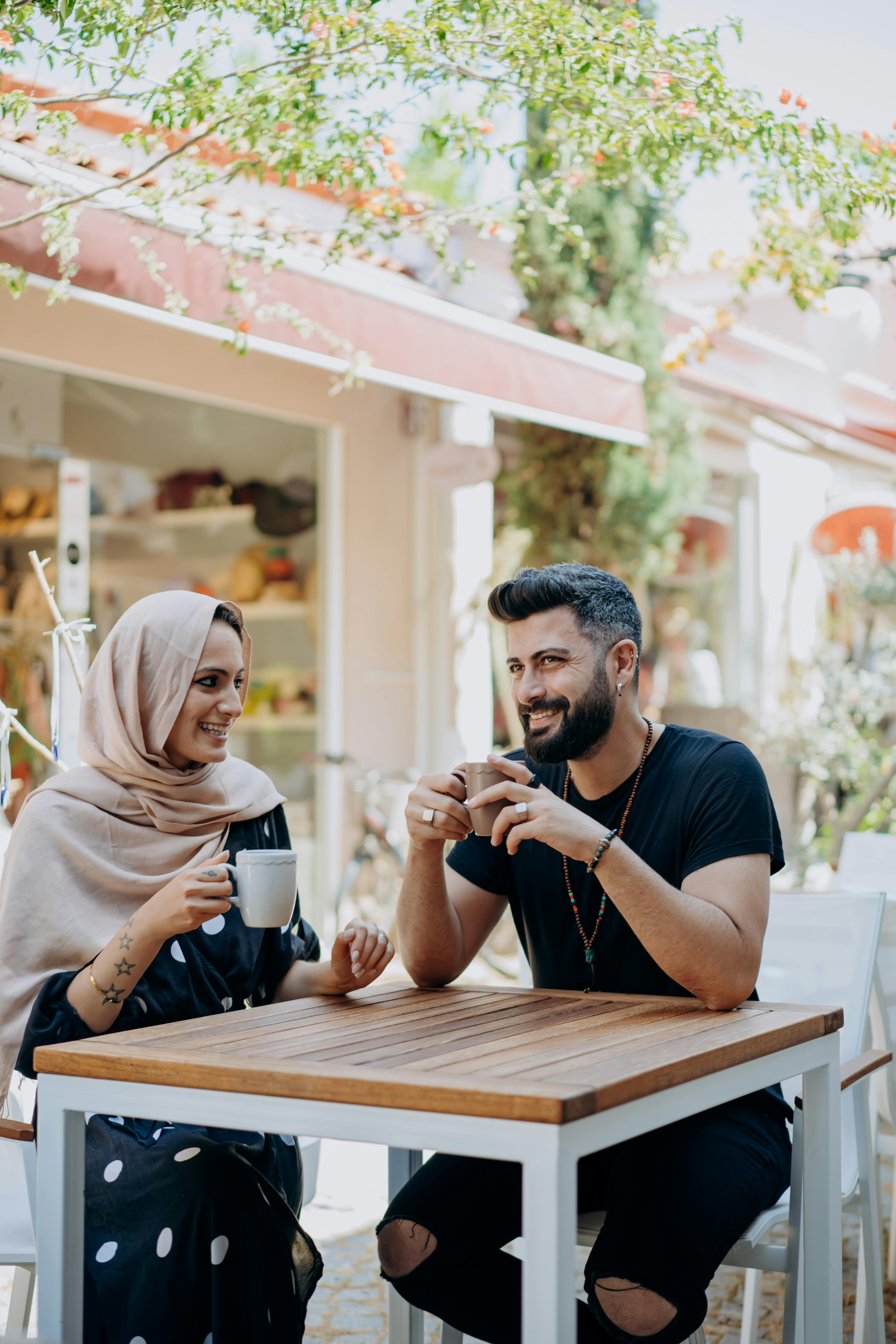 Couple Having Coffee at Outdoor Cafe