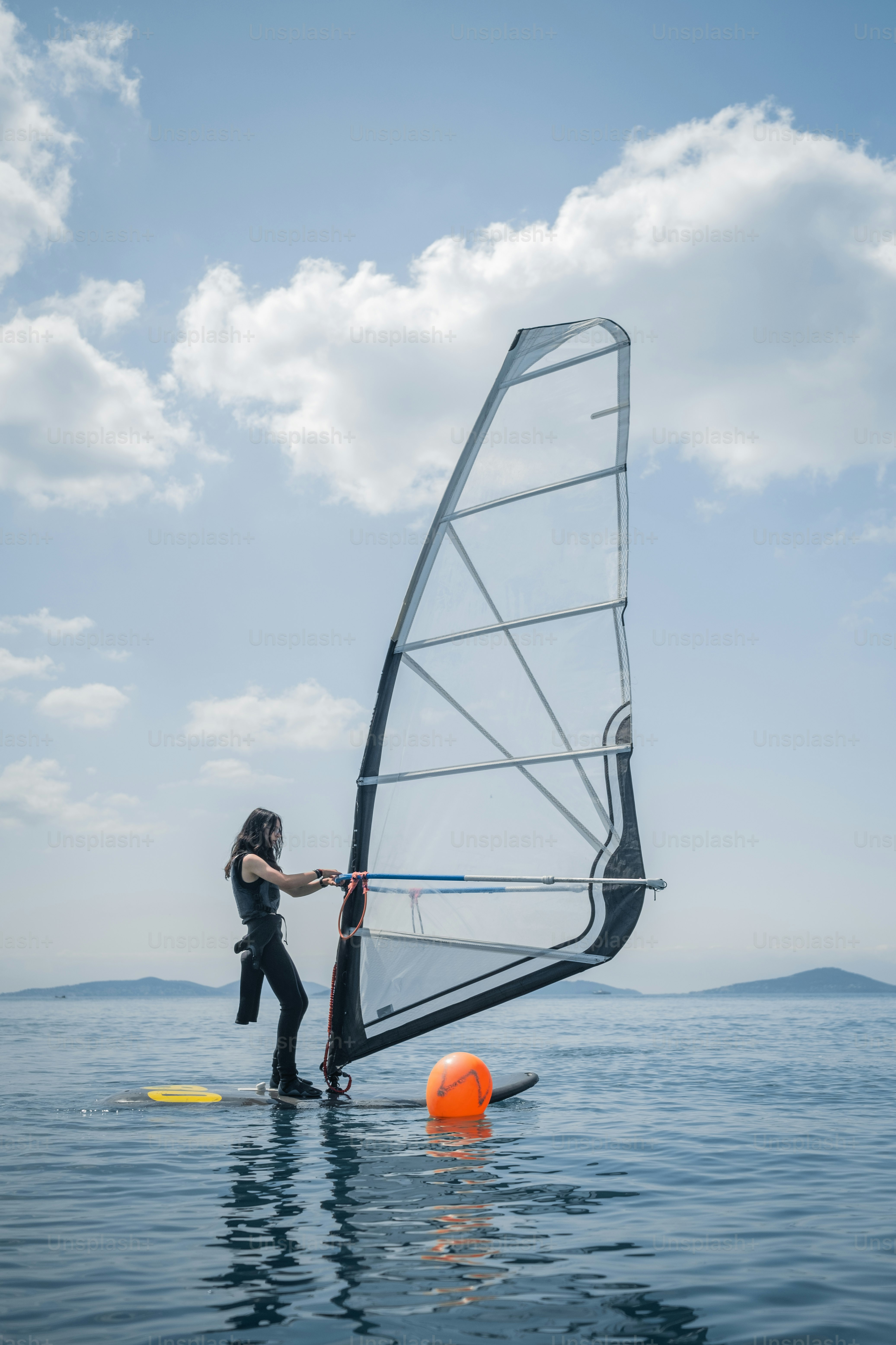 Windsurfer on Calm Open Sea