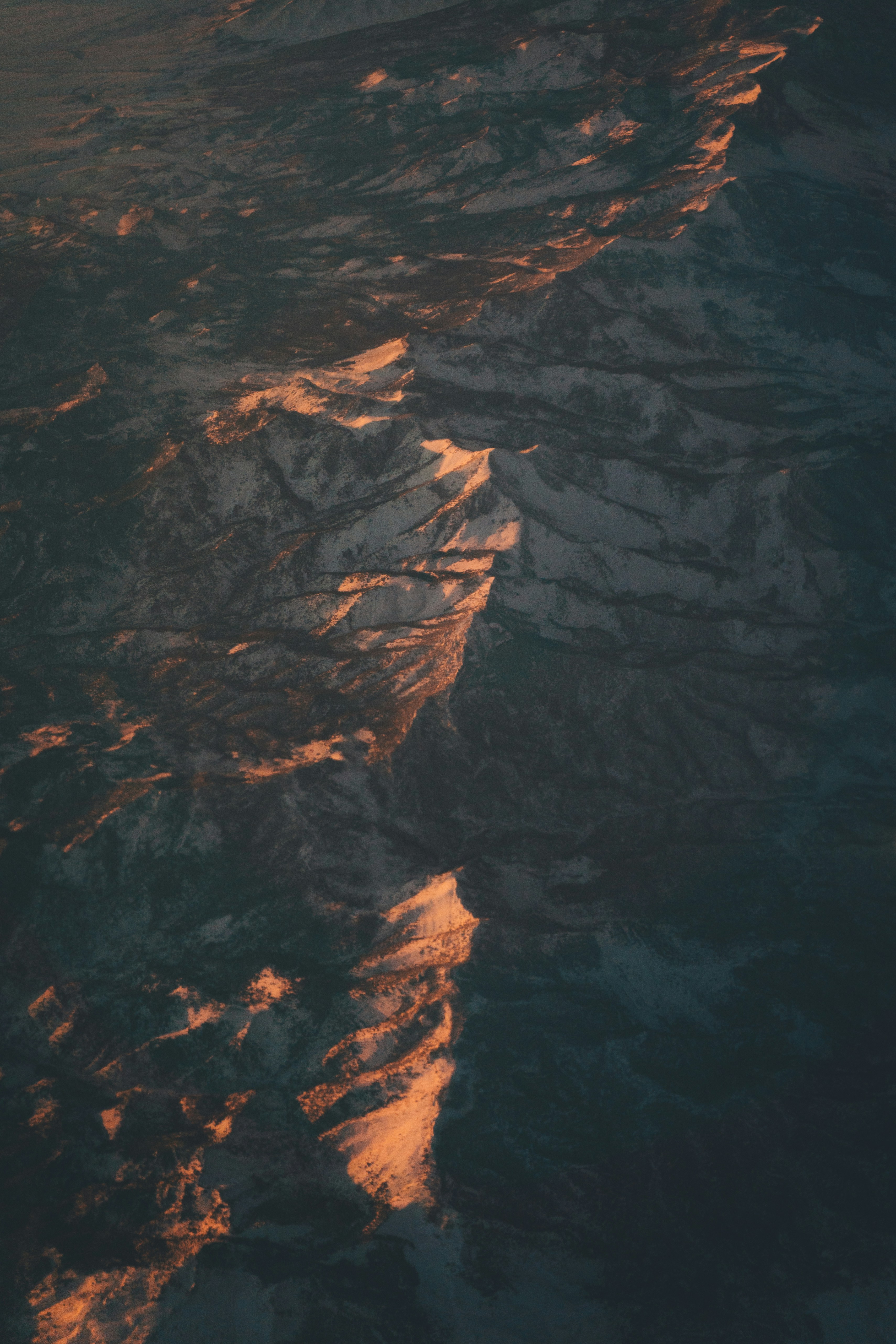 Sunlit Snowy Mountain Ridges