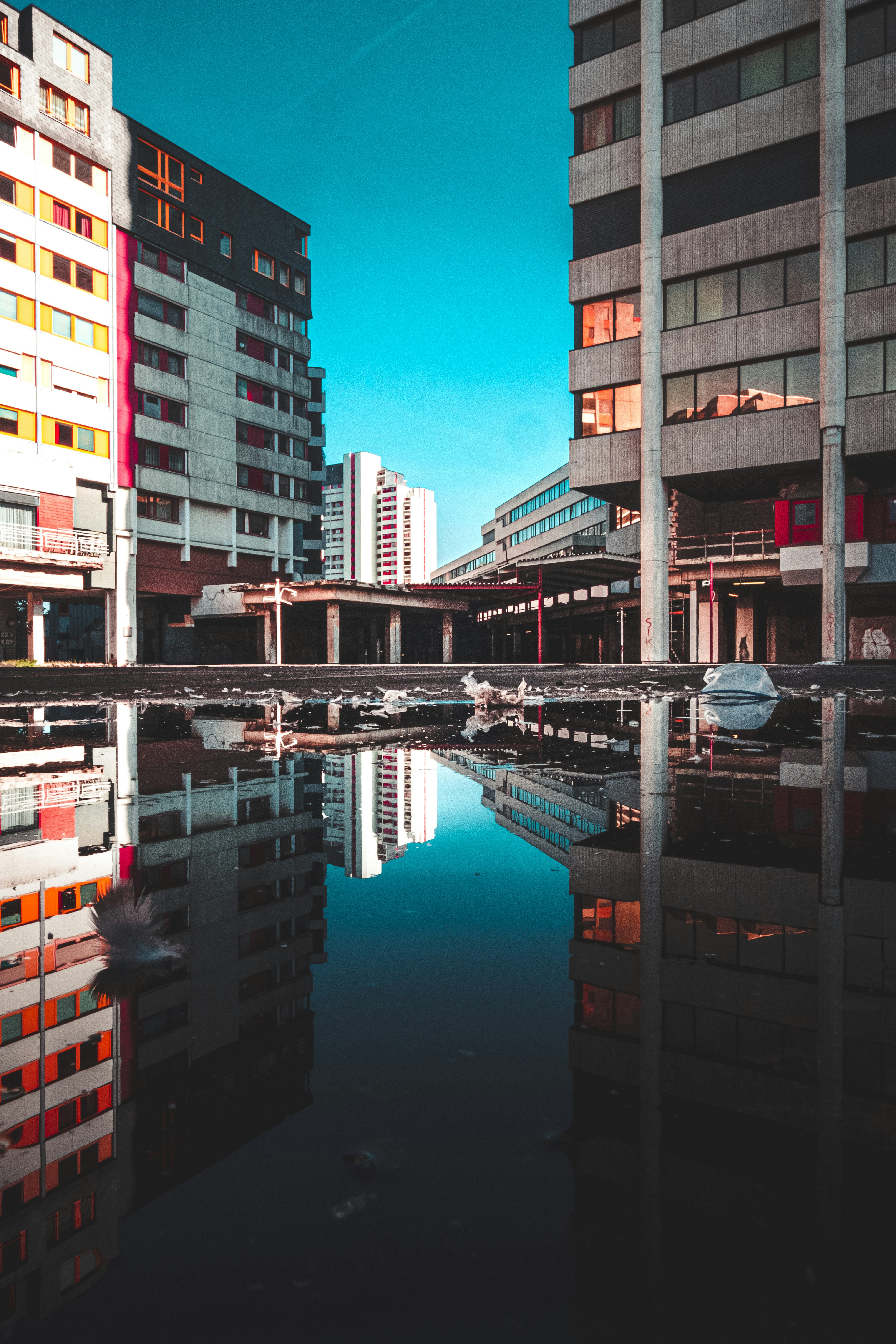 City Buildings Puddle Reflection