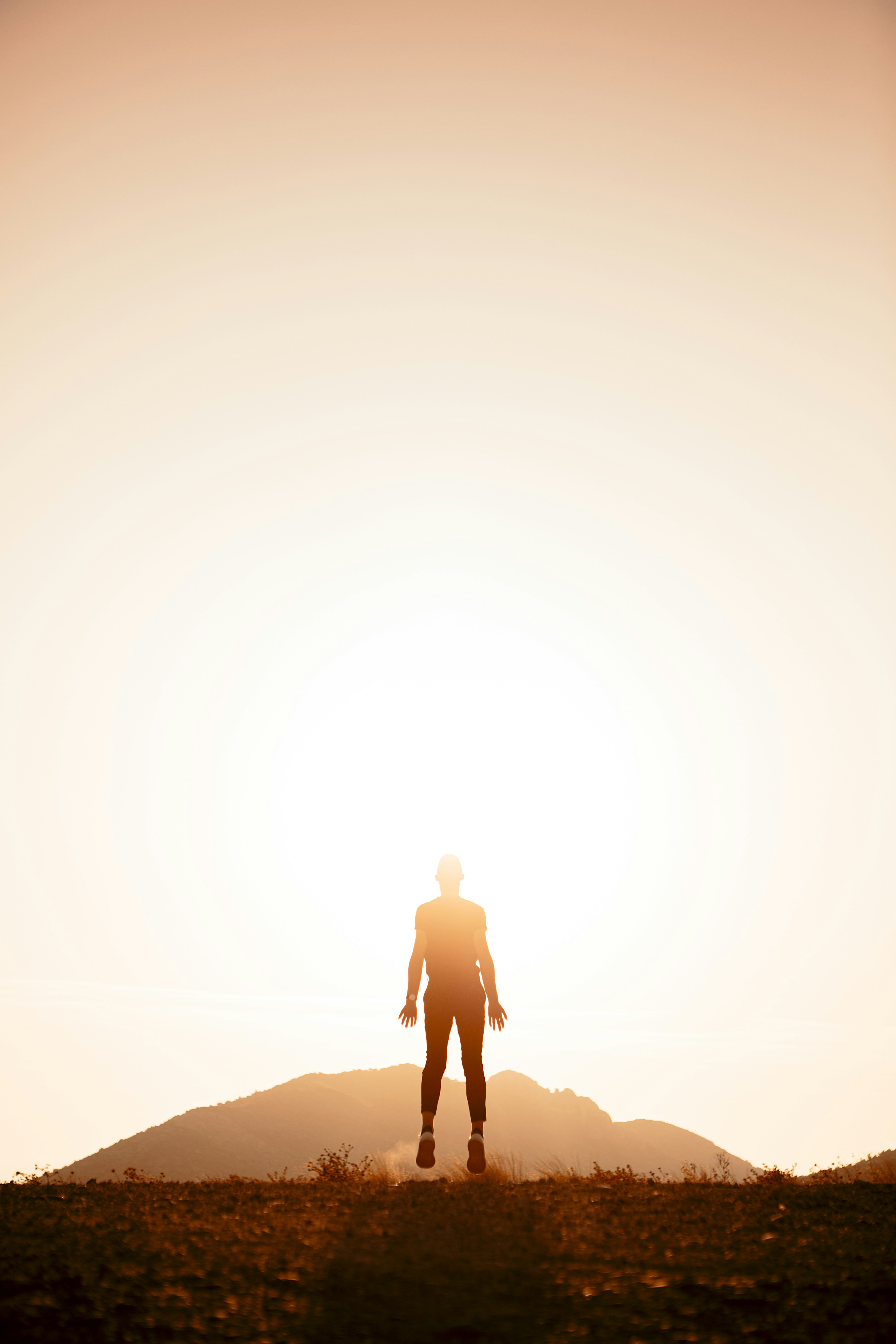 Jumping Person Silhouette At Sunset