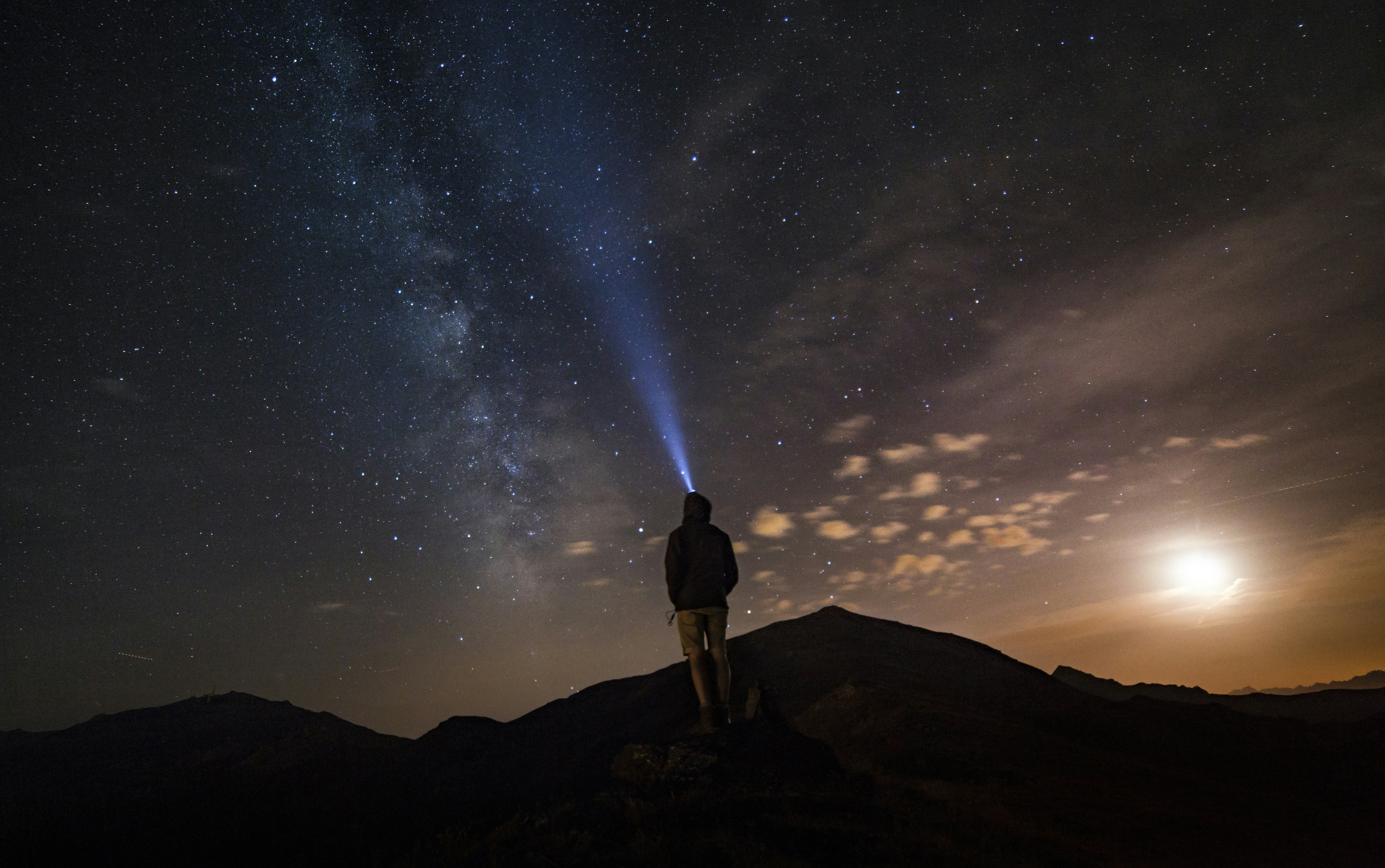 Hiker Watching Starry Night on Peak