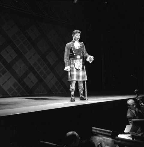 Performer in Scottish Kilt on Stage
