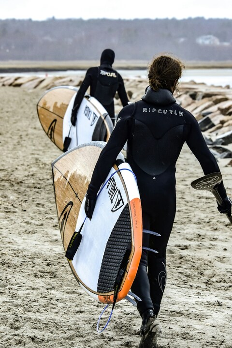Two Surfers on Sandy Beach