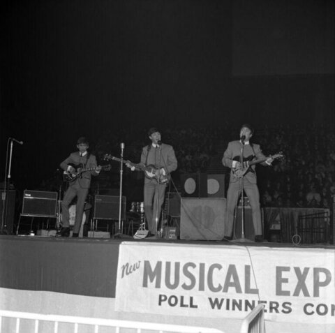The Beatles Performing on Concert Stage