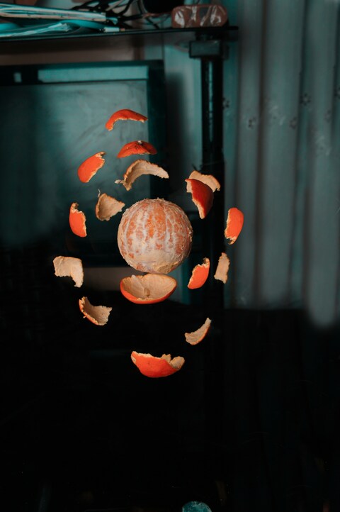 Floating Peeled Orange and Its Peels