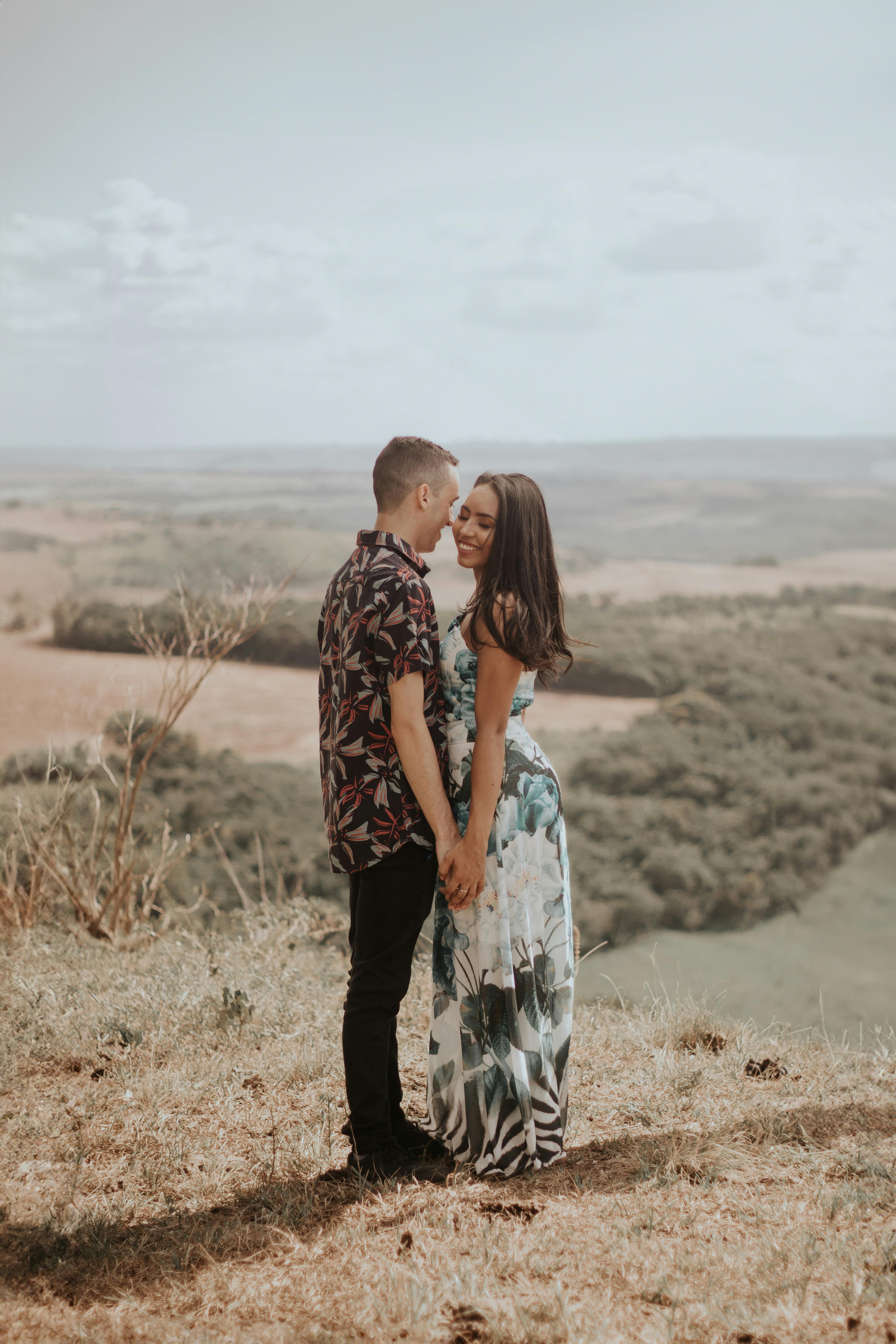 Engaged Couple on Hilltop Overlook