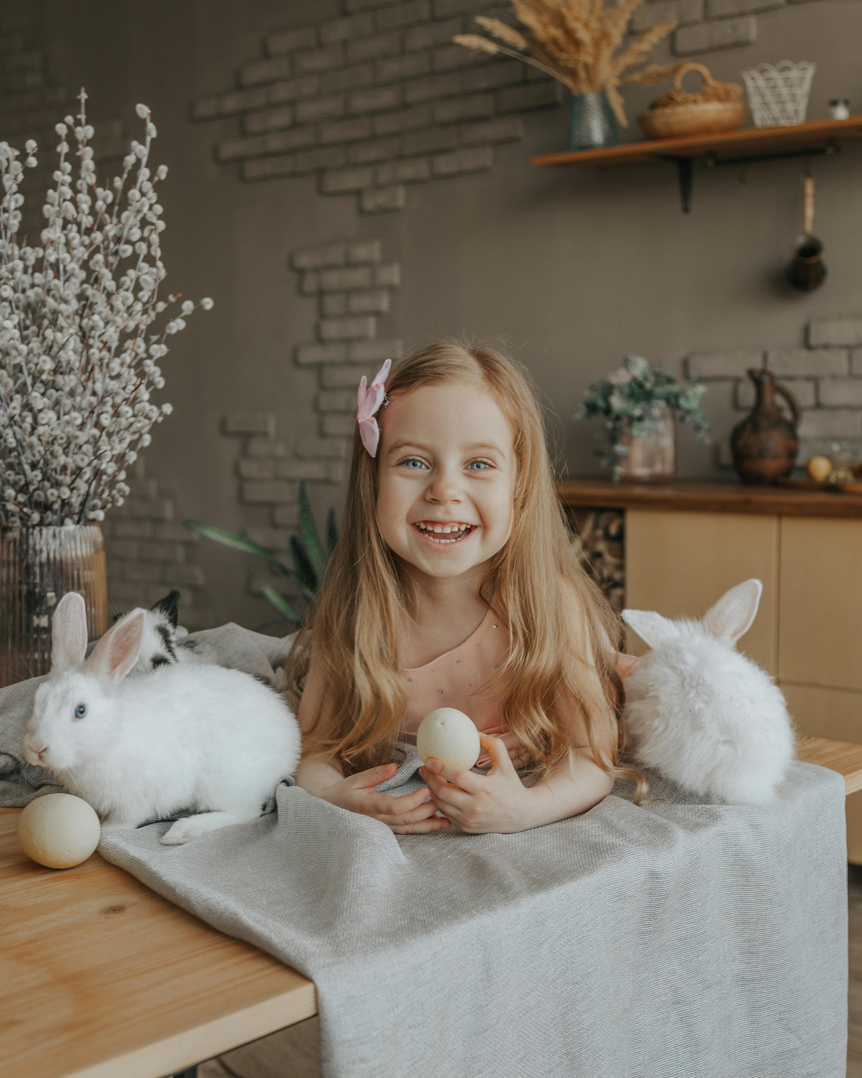 Smiling Girl With Bunnies and Easter Eggs