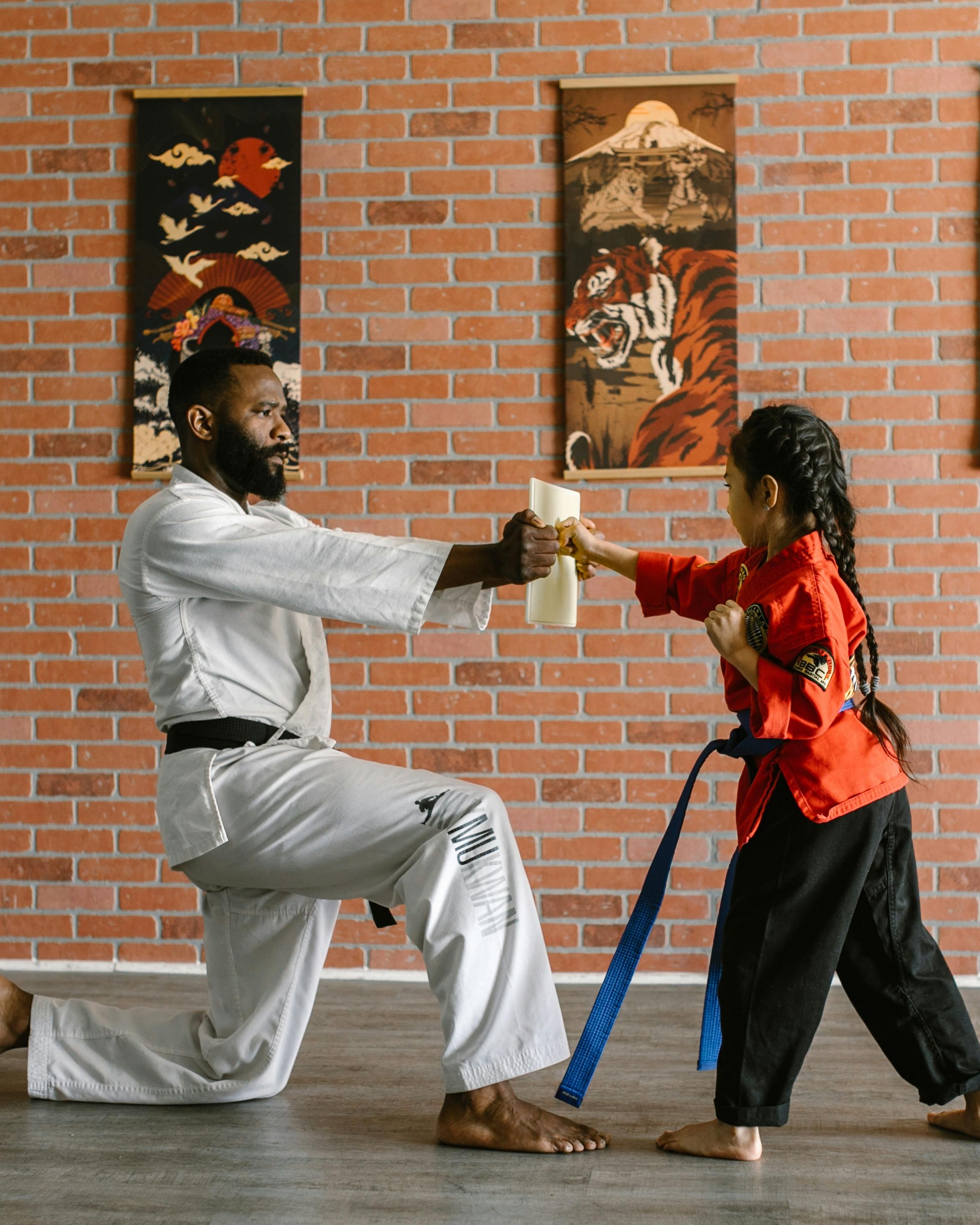 Martial Arts Instructor Trains Young Student