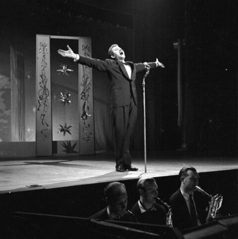 Male Singer Performing on Stage