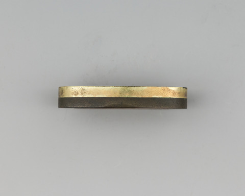 Side View of Two-toned Metal Object