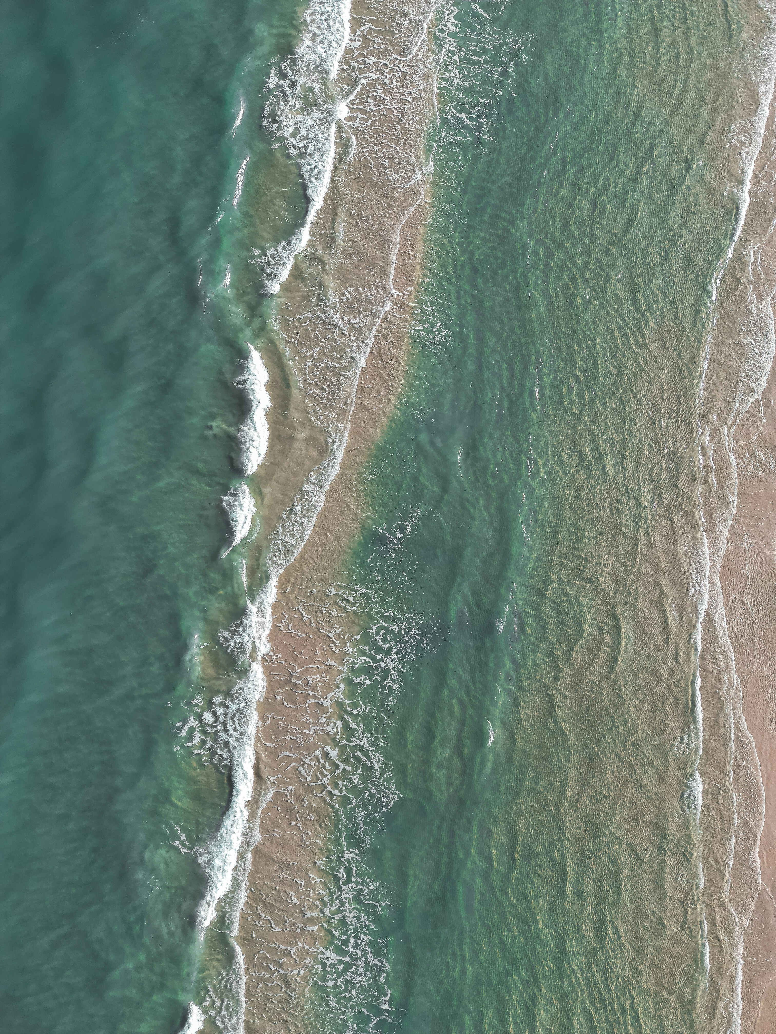 Aerial View of Coastal Beach Waves