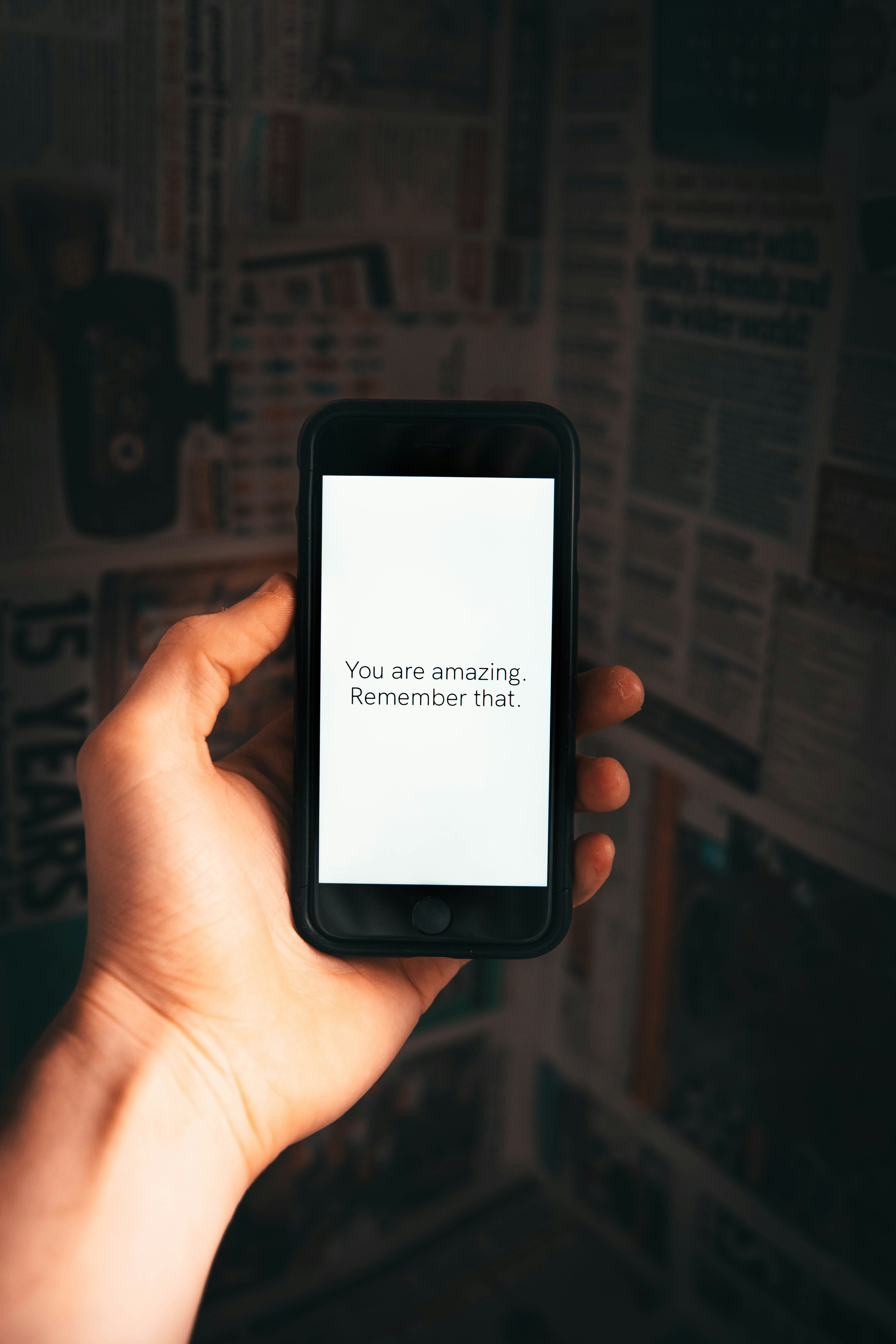 Hand Holding Phone With Positive Message