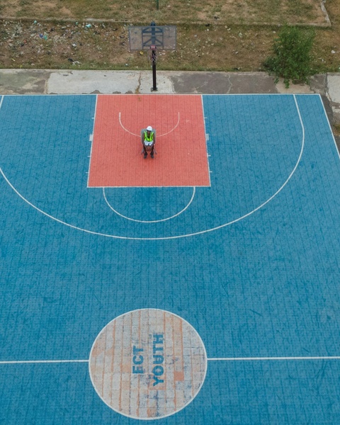 Construction Worker on Basketball Court