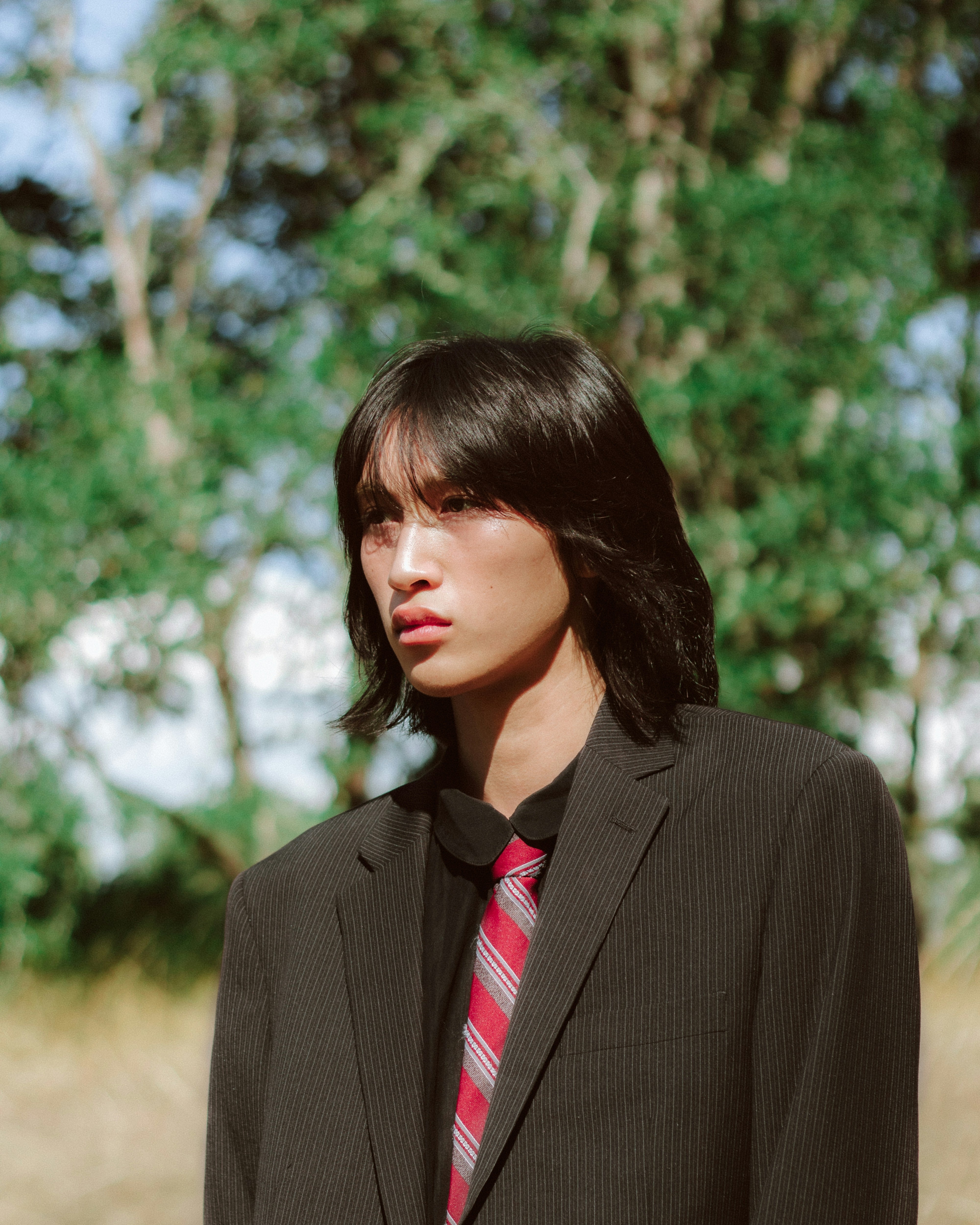 Young Man In Suit Outdoors