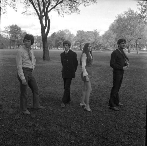 Four People Standing in Park