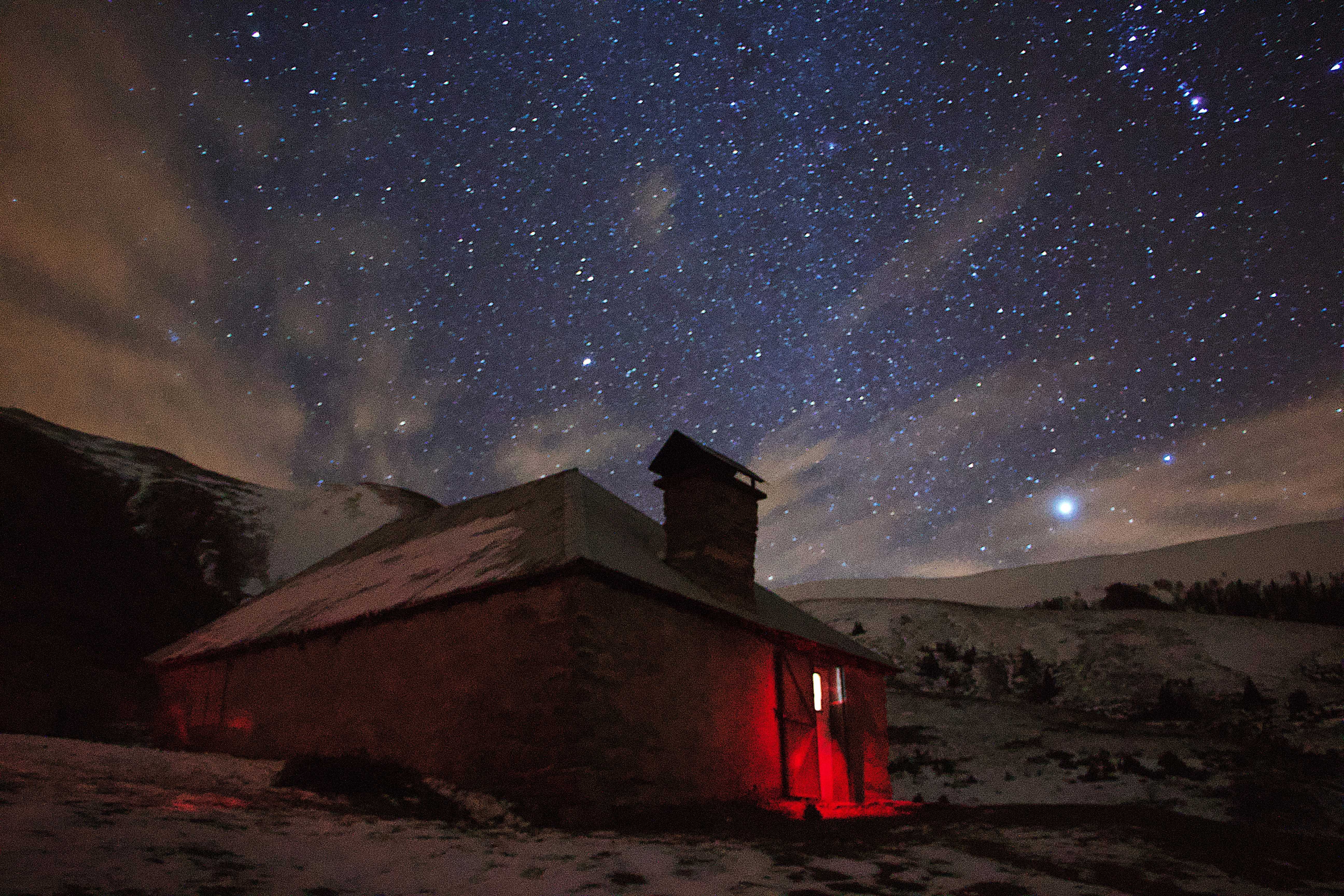 Starry Night Over Snowy Mountain Hut