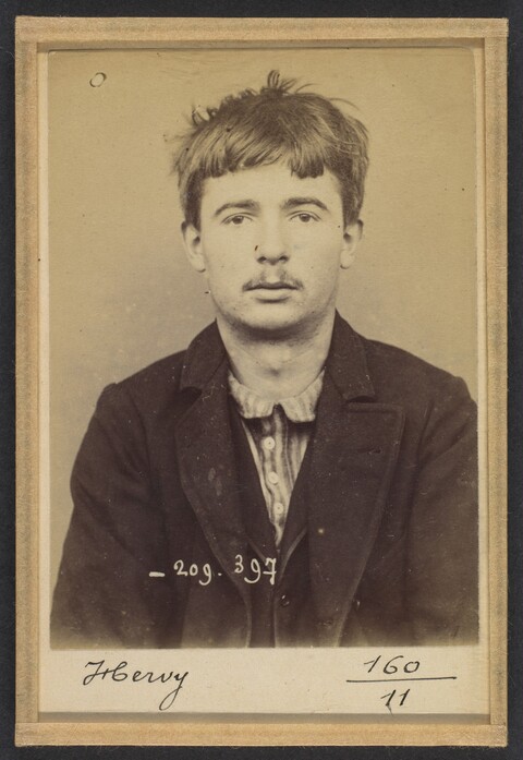 Vintage Portrait Mugshot of a Young Man