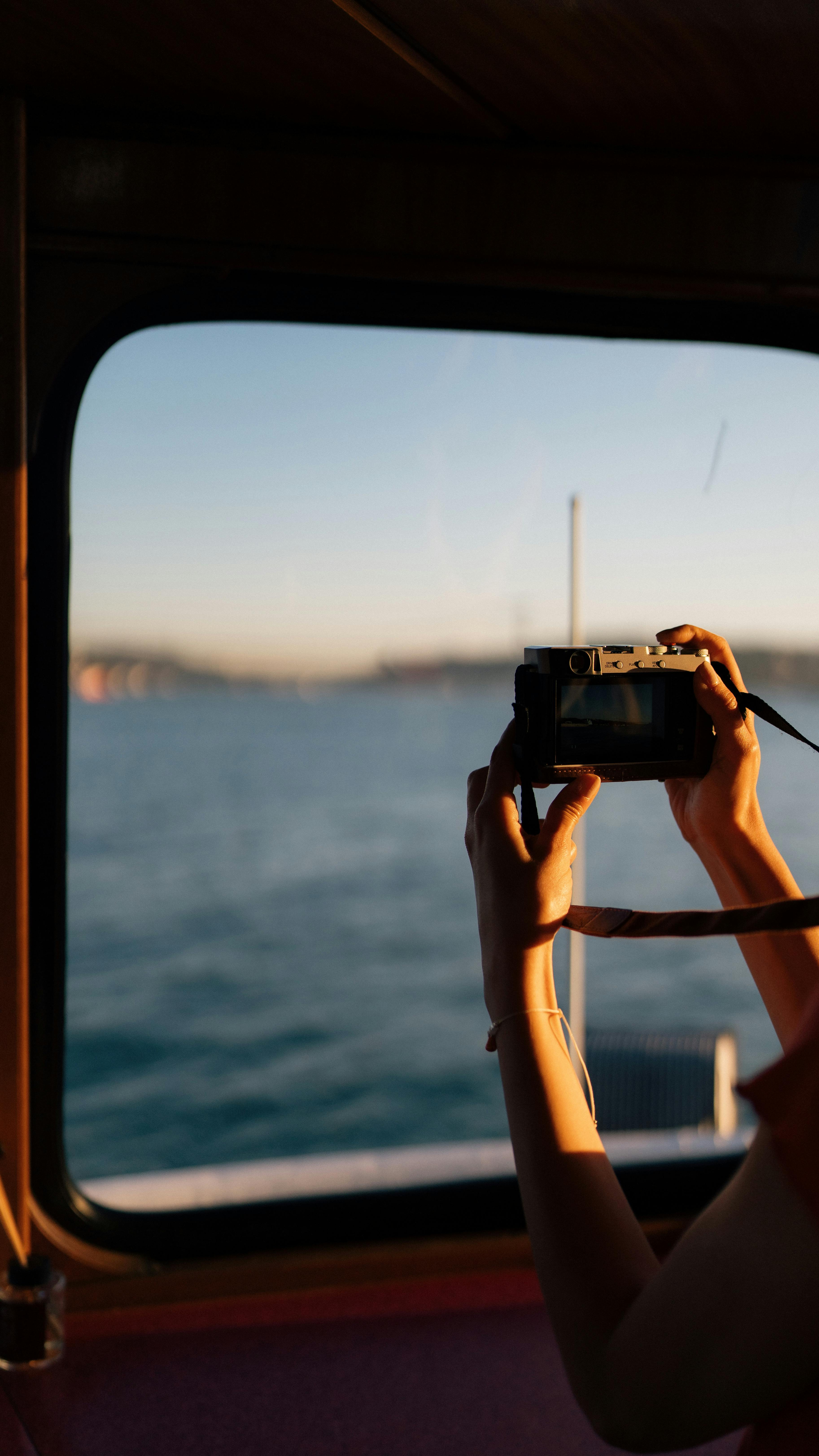 Photographing Sea View From Boat