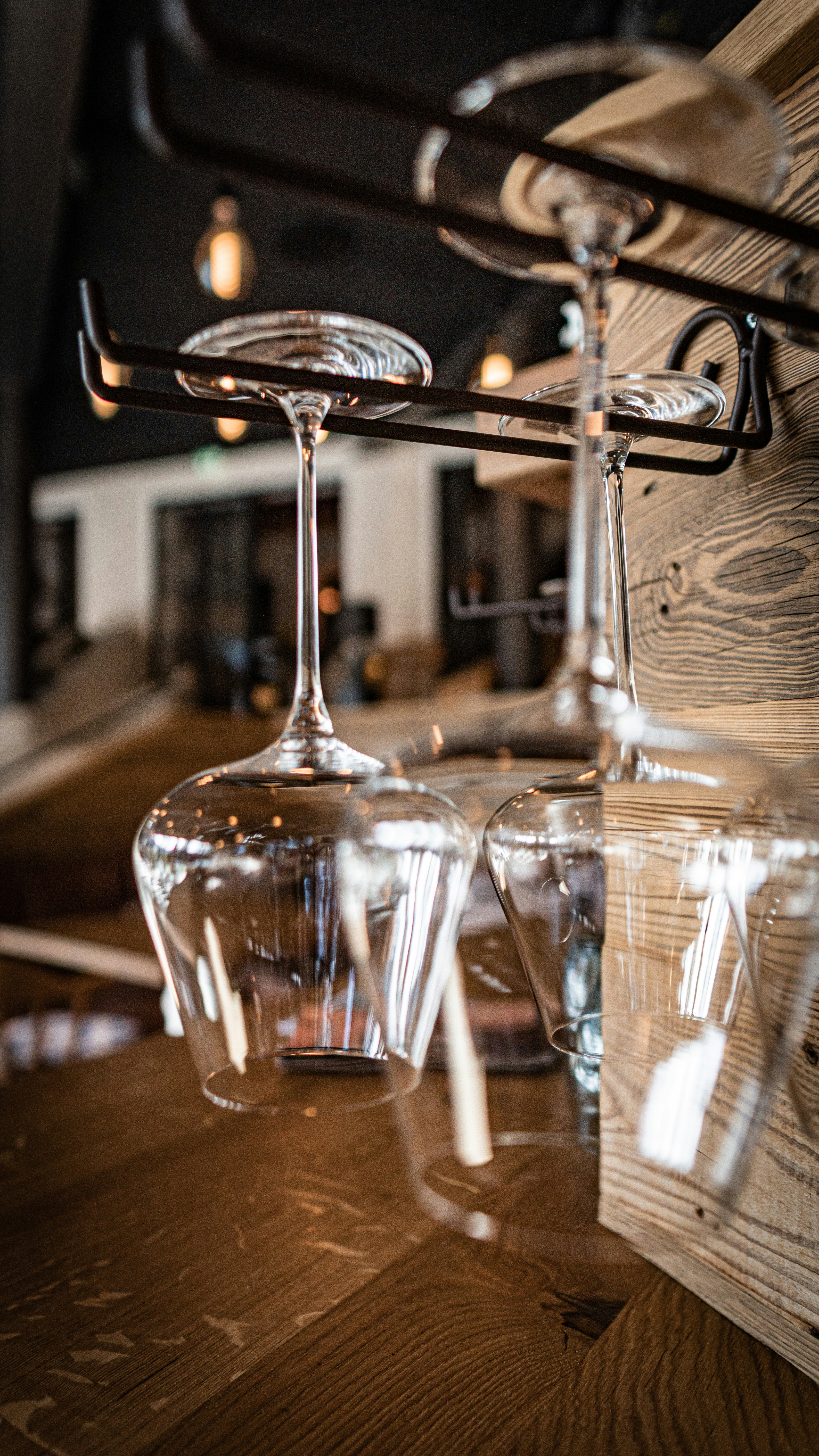 Hanging Wine Glasses at Rustic Bar