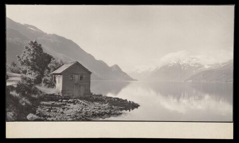 Wooden Boathouse by Mountain Lake