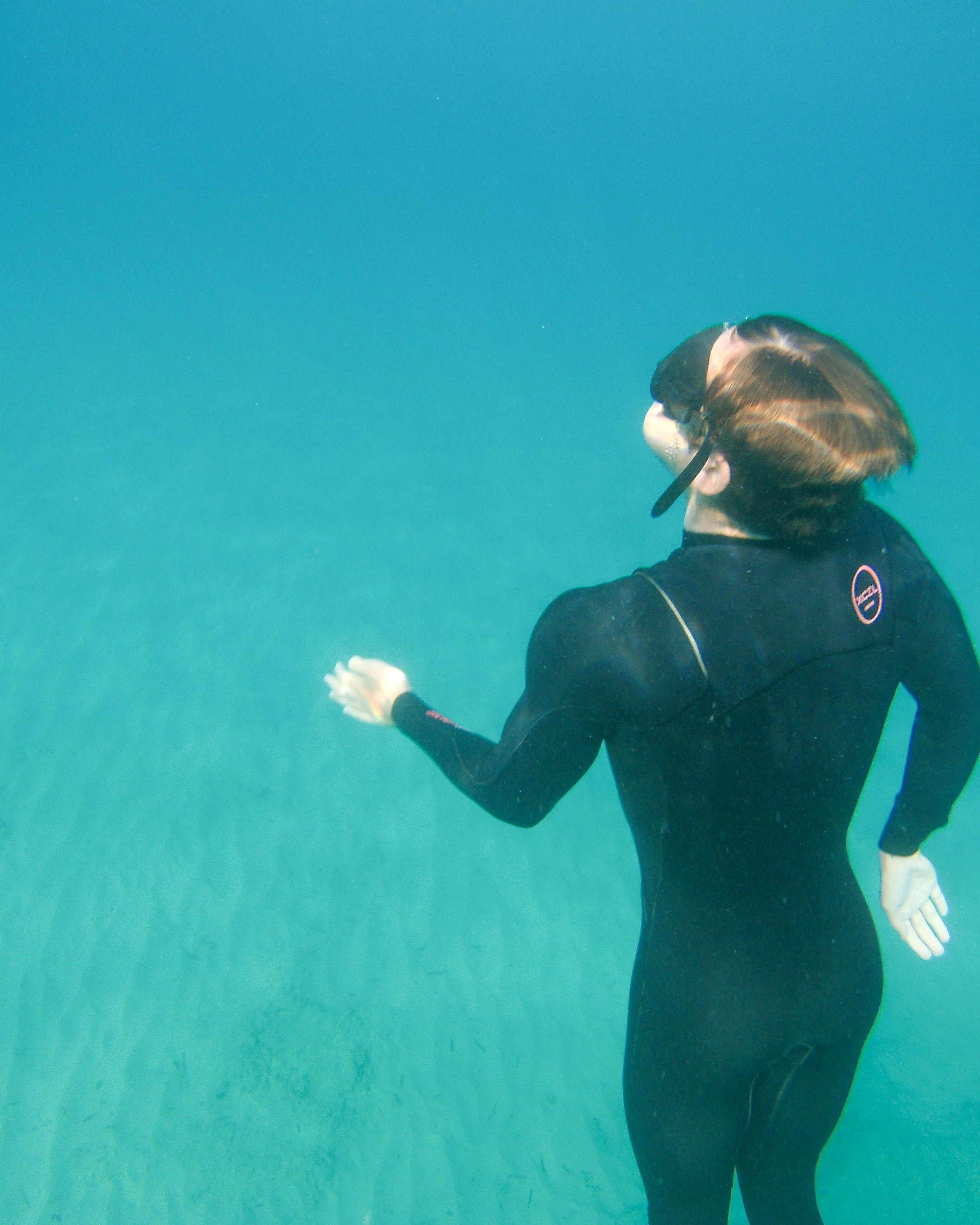 Freediver Underwater in Clear Blue Sea