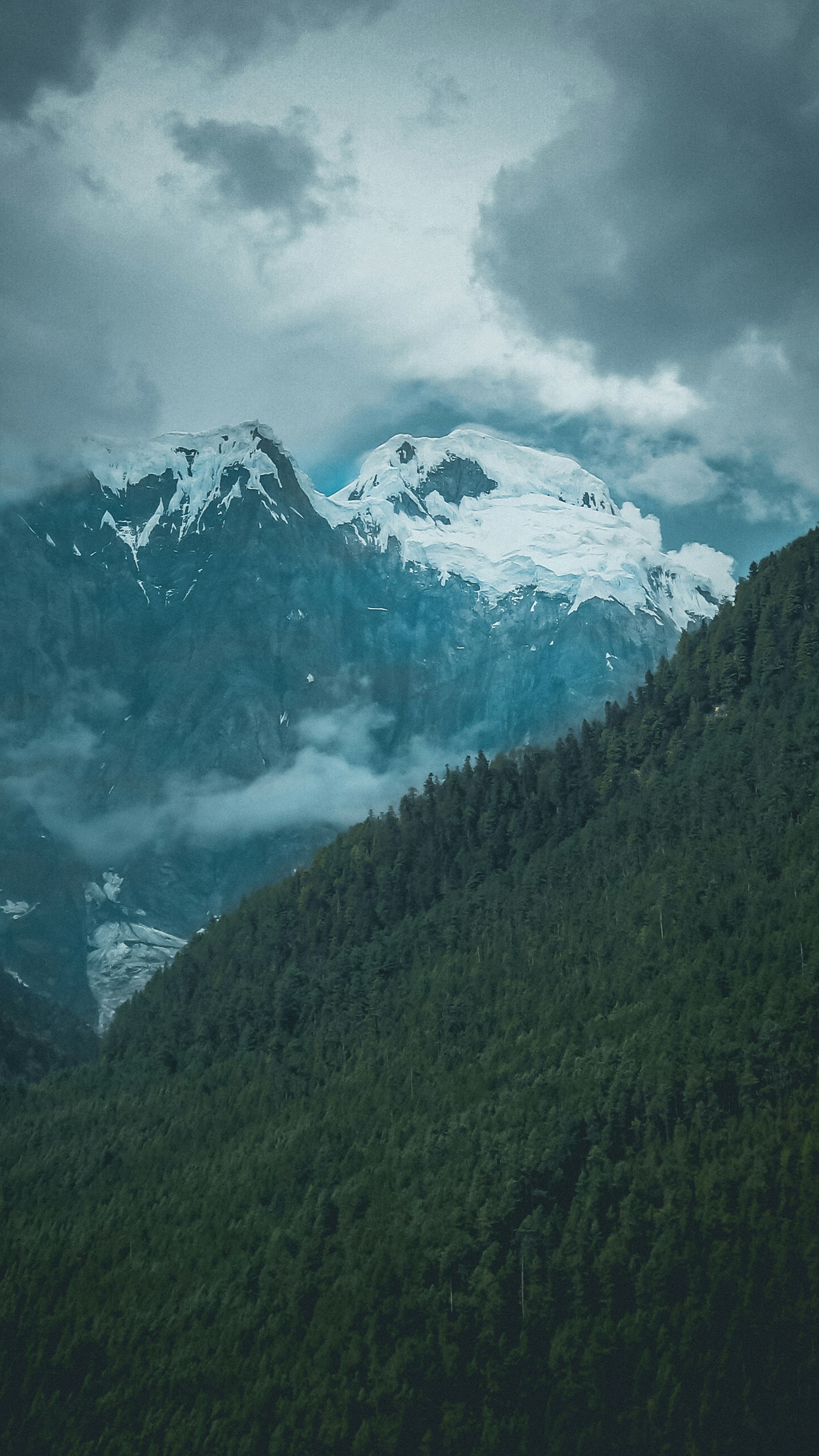 Cloudy Sky Over Snow-capped Mountain Range