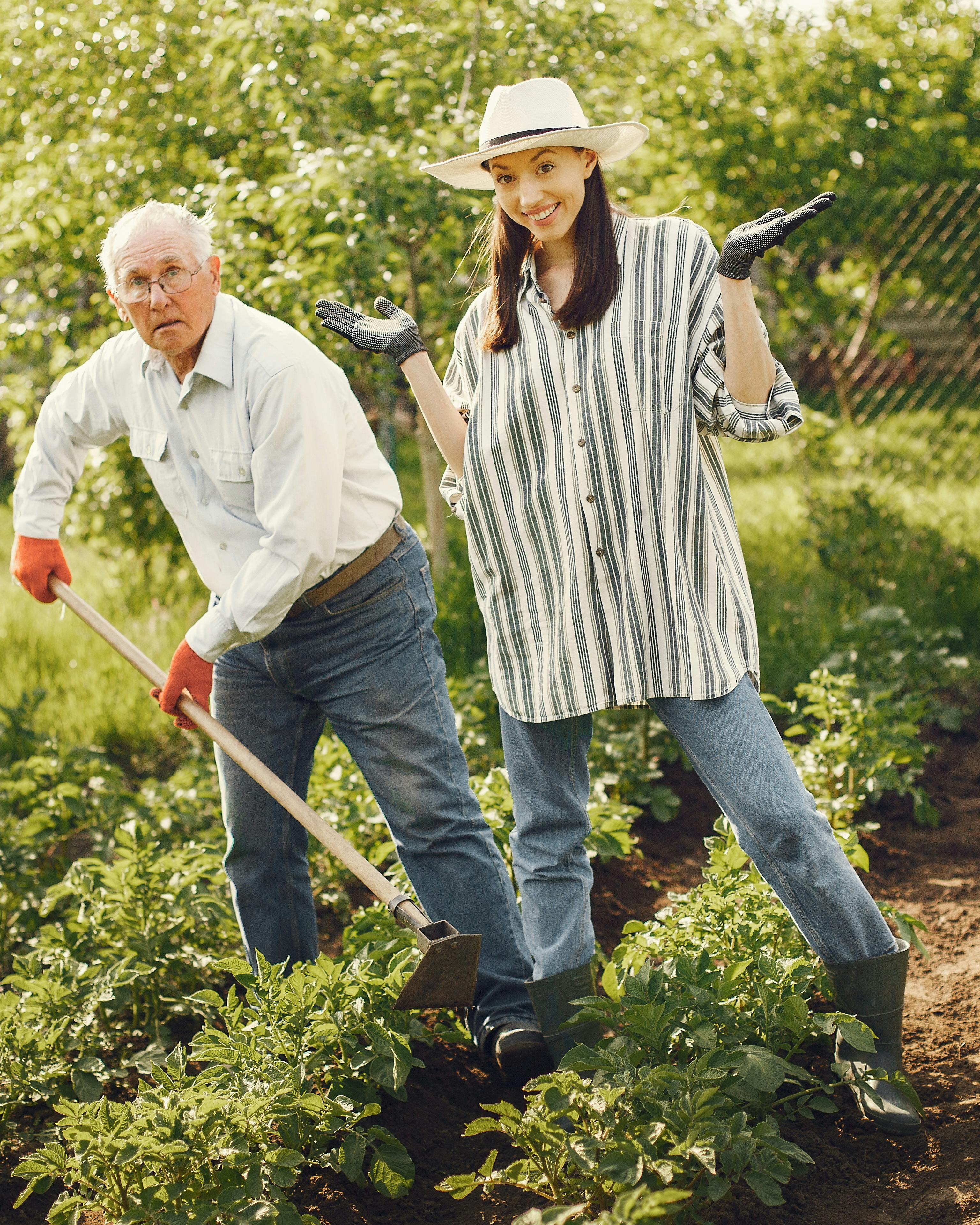 Two Gardeners Posing in Vegetable Garden