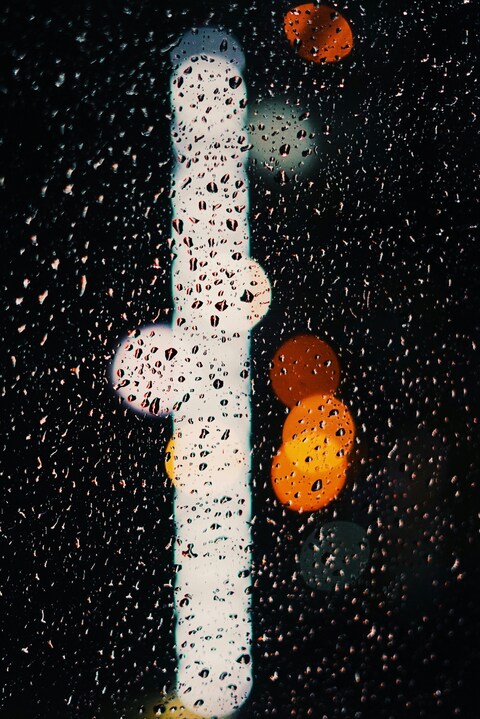 Raindrops on Glass at Night