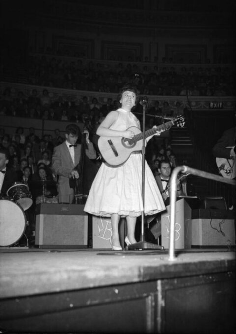 Female Singer Performing on Concert Stage