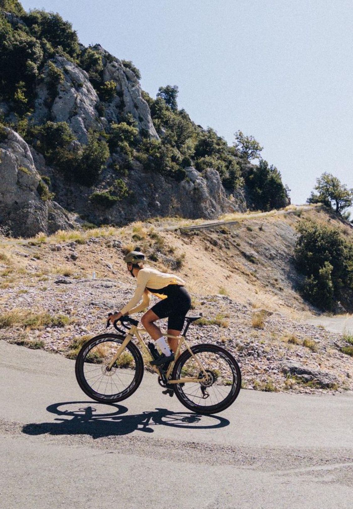 Cyclist Climbing Mountain Road