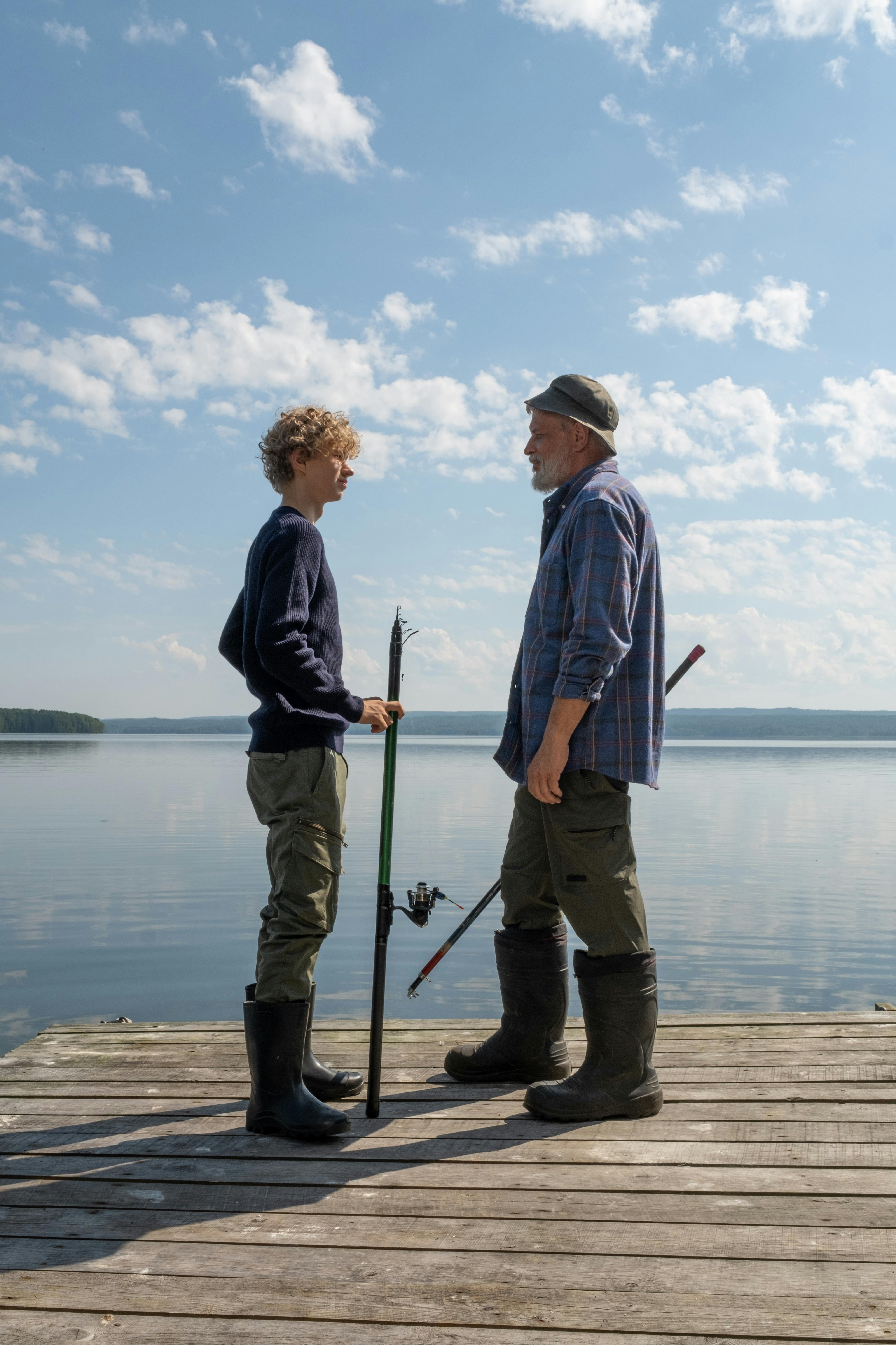 Two People Fishing on Lake Dock