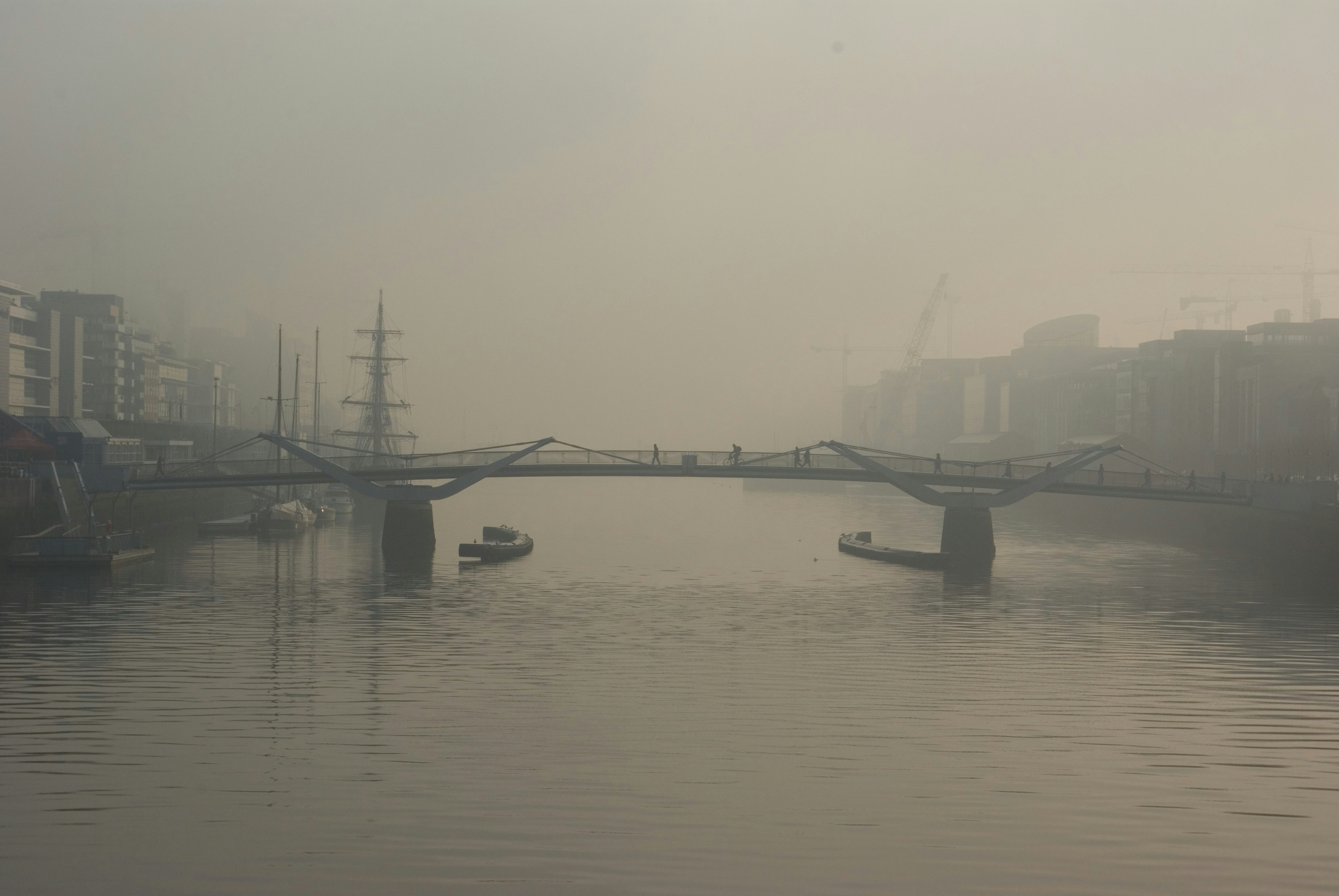 Foggy Urban River Bridge View