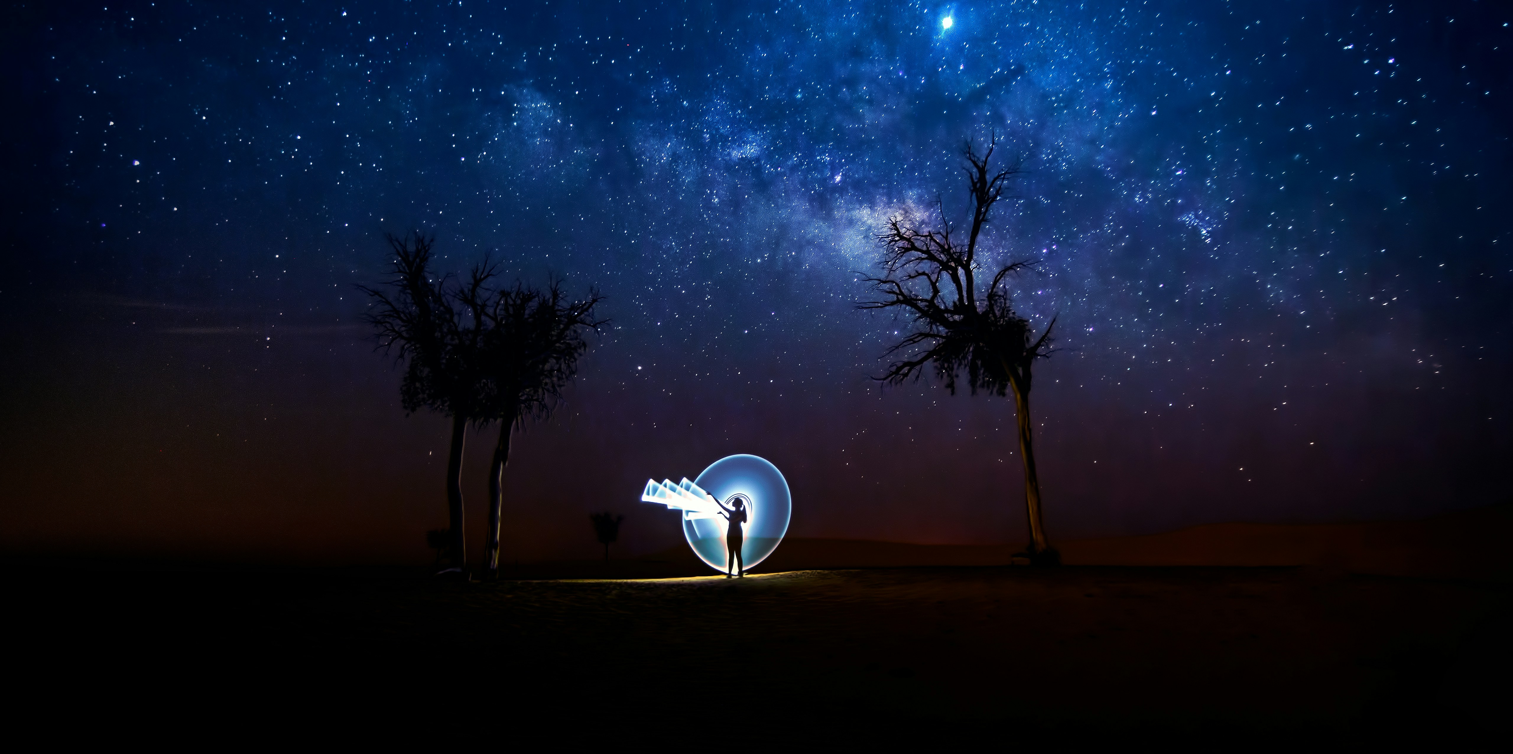 Light Painting Under Starry Night Sky