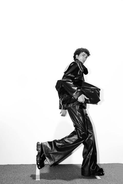 Male Fashion Model in Leather Outfit Posing