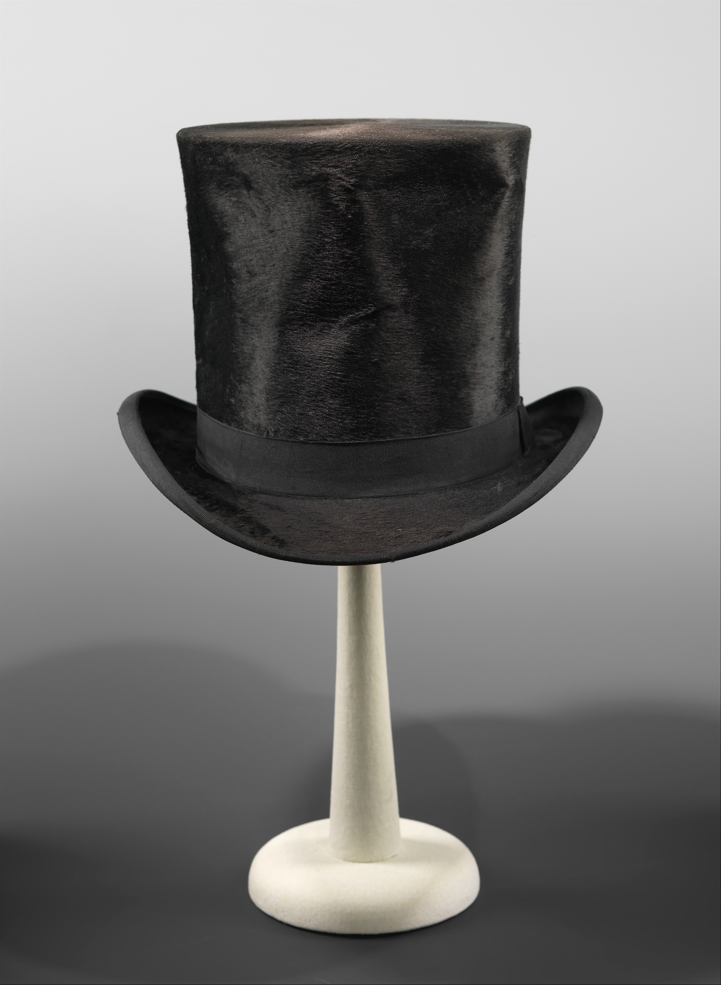 Black Top Hat on Display Stand