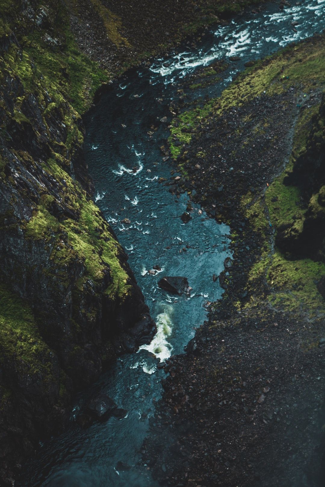 River Flowing Through Mossy Gorge
