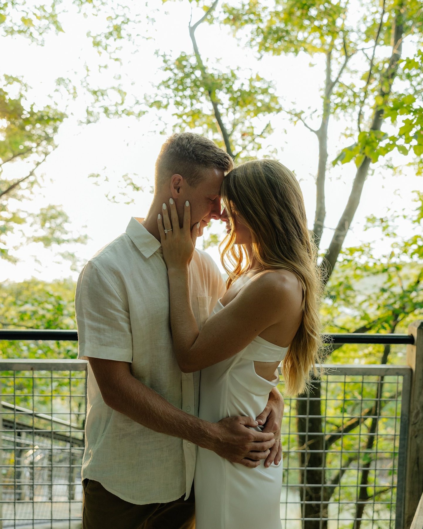 Engaged Couple Embracing Outdoors