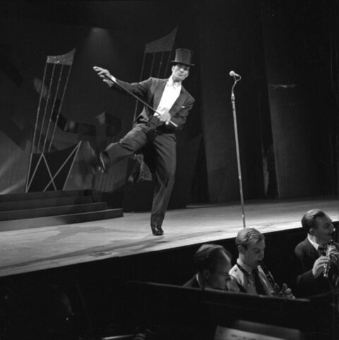 Dancer in Top Hat Performing on Stage