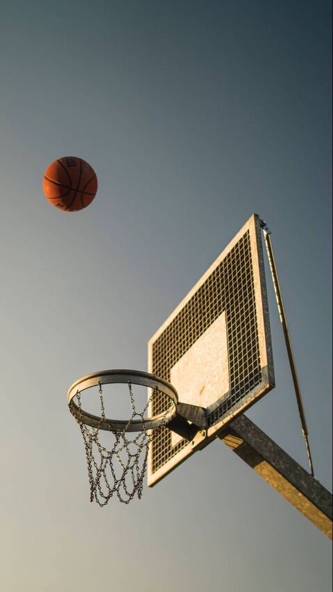 Basketball Flying Toward Outdoor Hoop