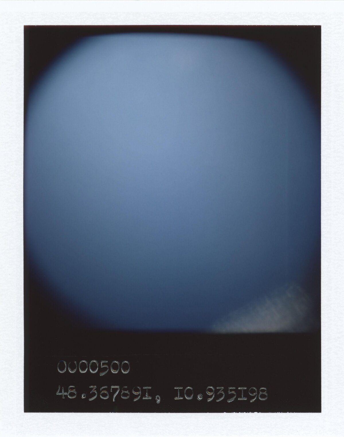 Polaroid Shot of Blue Sky with Coordinates